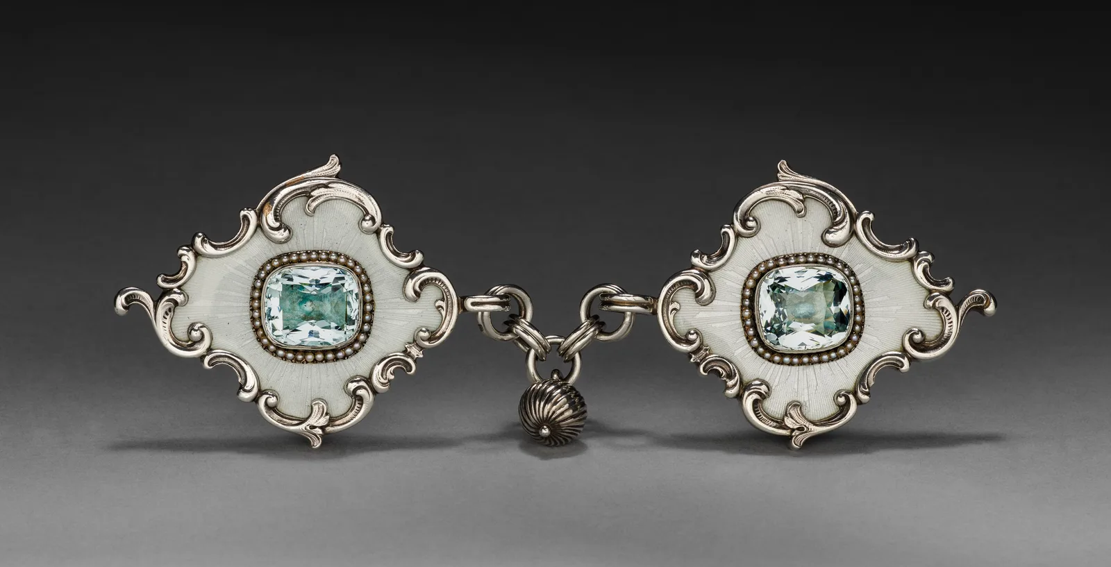 Fabergé silver cloak clasp, two diamond-shaped oyster-enamel plaques each holding a cushion aquamarine in a half-pearl bezel
