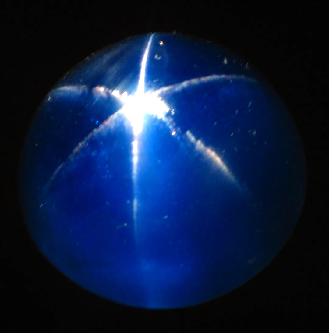 A close view of the Star of Asia, a deep blue star sapphire cabochon with a sharp six-rayed star