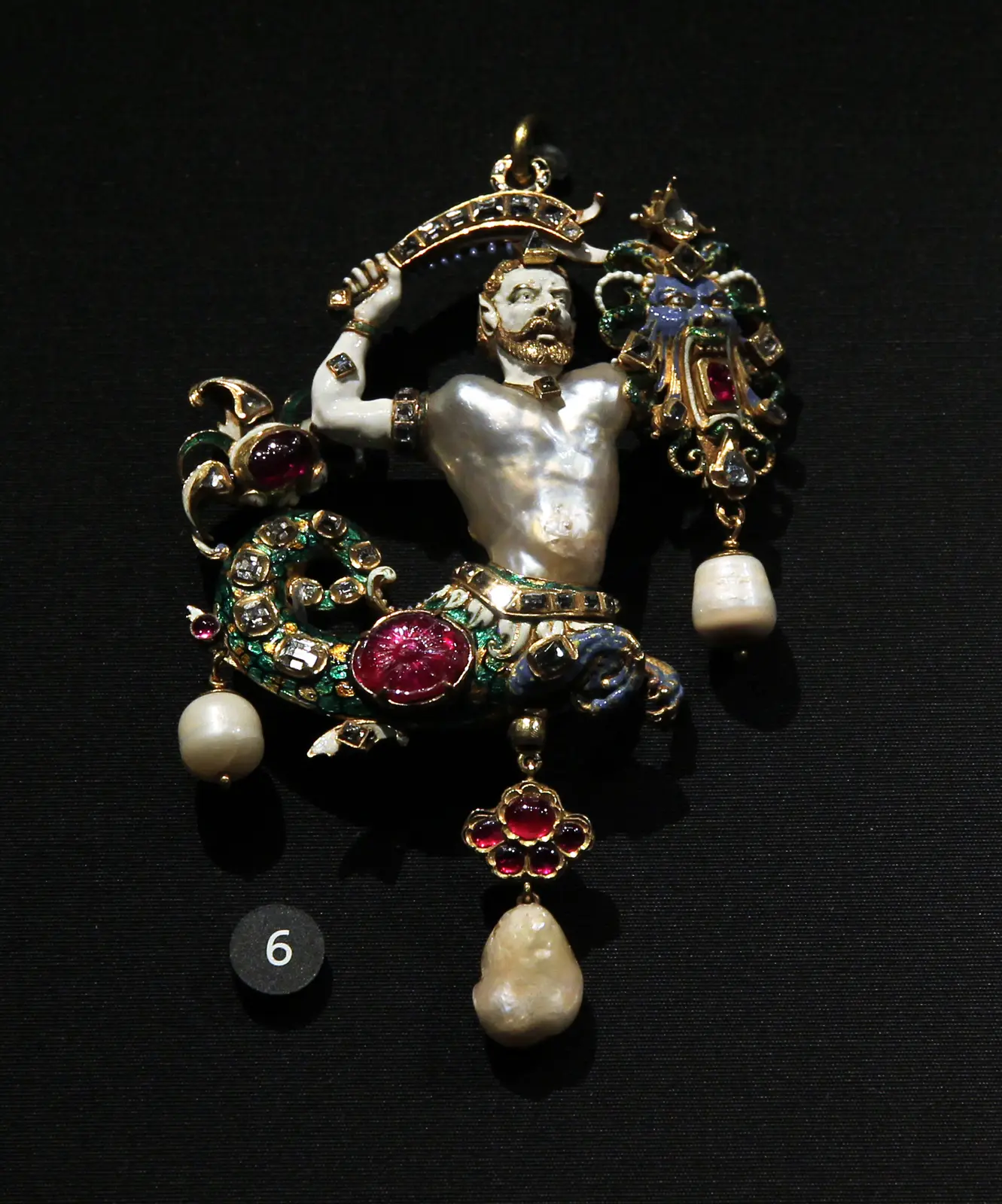 The Canning Jewel, a merman pendant whose torso is a baroque pearl, in enamelled gold with diamonds and rubies