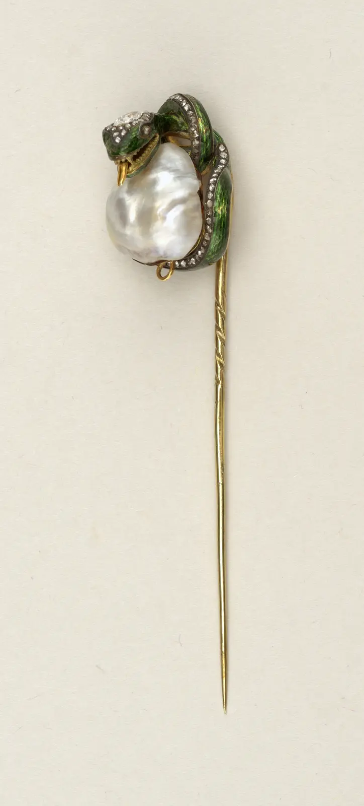 A French stick pin with an enamelled serpent above a large irregular freshwater pearl