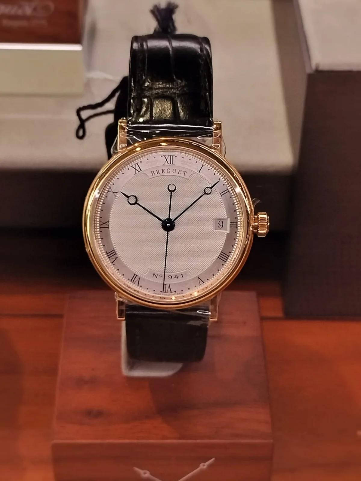 Breguet Classique reference 5177 in yellow gold with a fluted case, a silvered dial, and blued hands with hollow tips, shown off the wrist