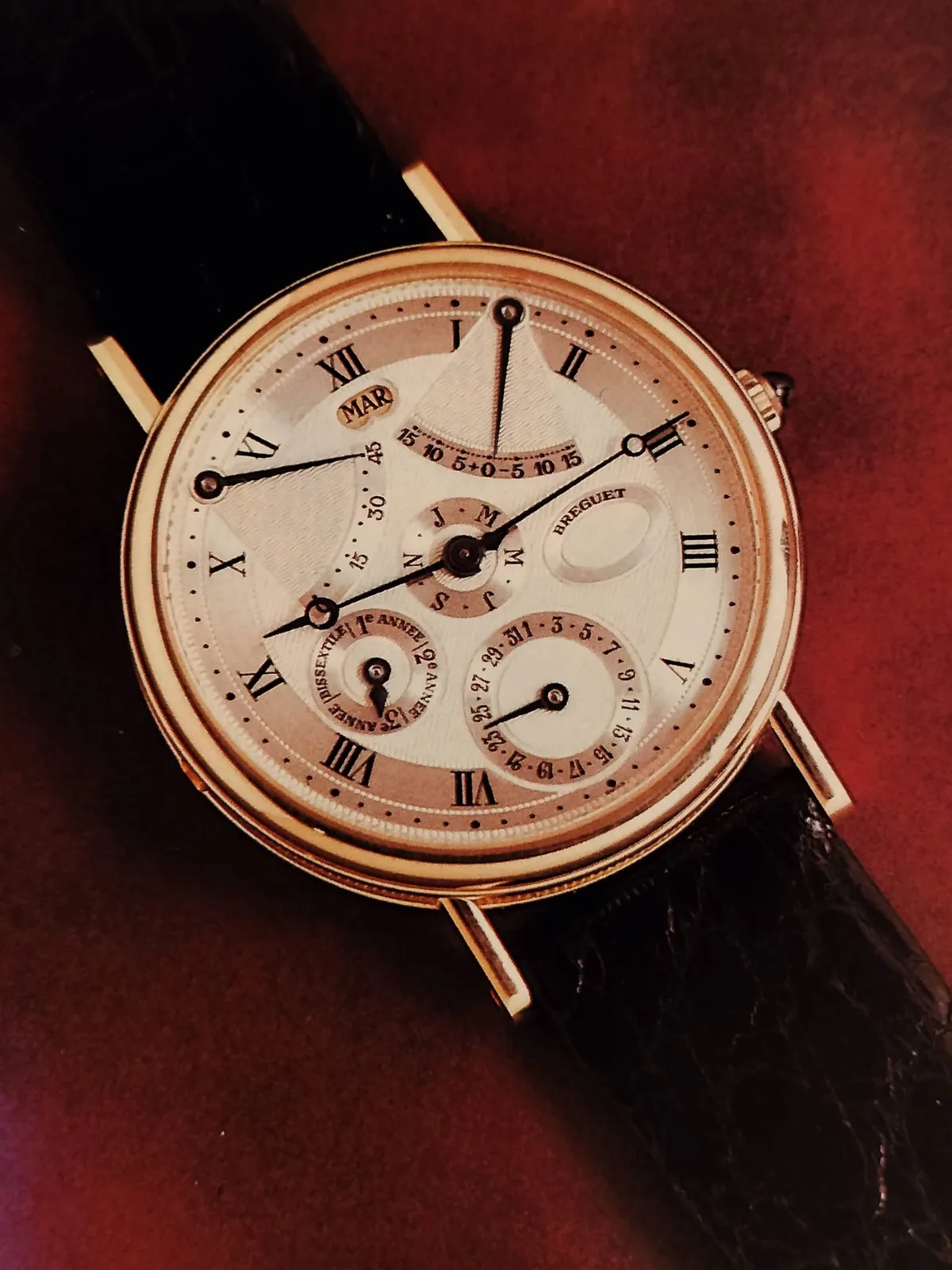 Breguet Classique reference 3744 with a perpetual calendar, equation of time, and blued hands ending in hollow rings, shown off the wrist