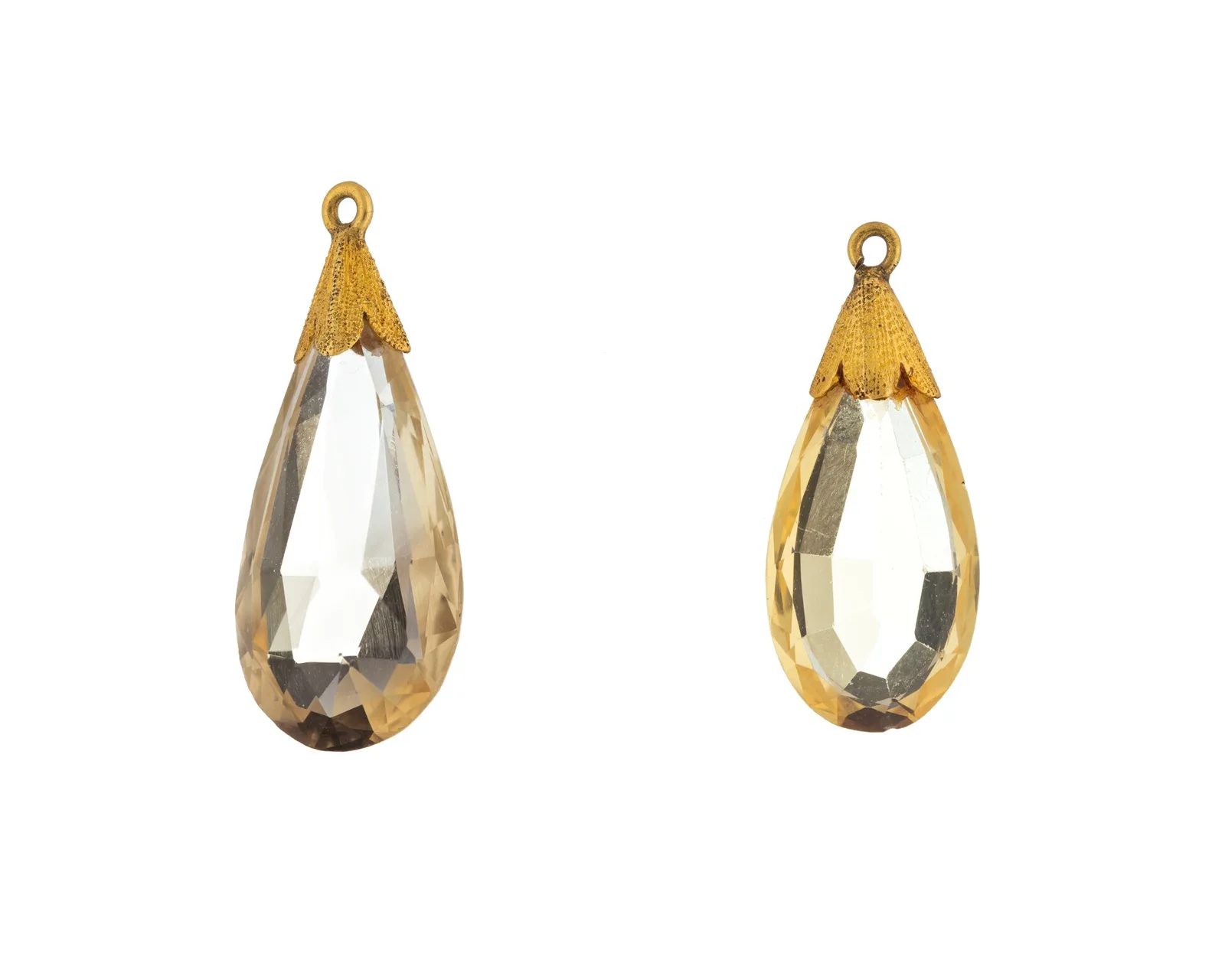 Pair of faceted honey-yellow citrine teardrops, each hung from a small gold cap at the tip