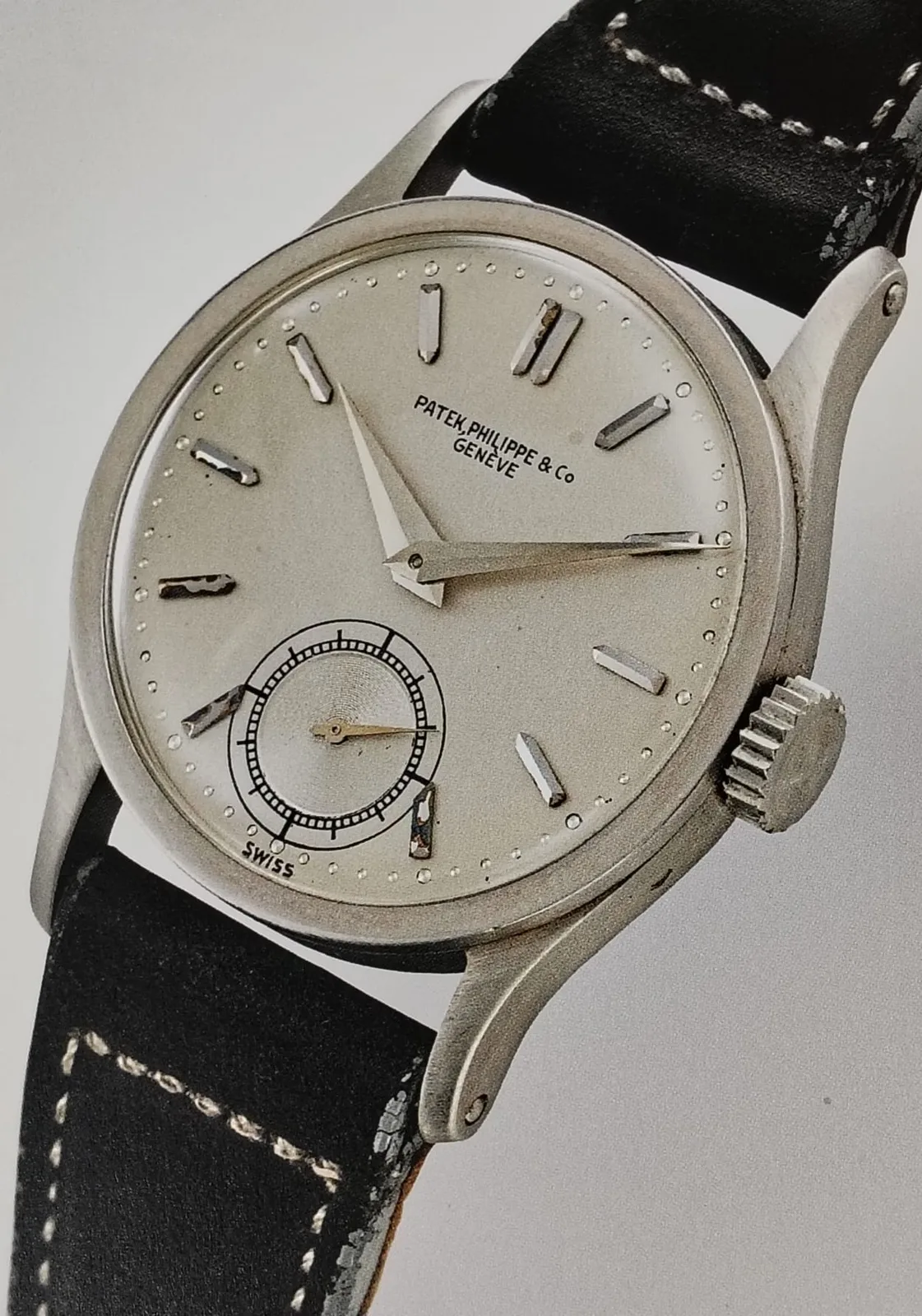 Patek Philippe Calatrava reference 96 from the late 1930s, a round gold-colored case with a two-tone sector dial, shown off the wrist