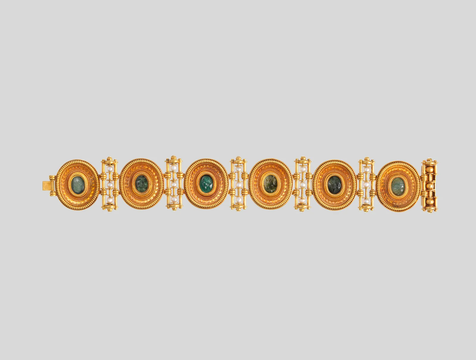 Castellani gold bracelet of six oval hardstone cameos with profile heads, granulated frames, and pearl links
