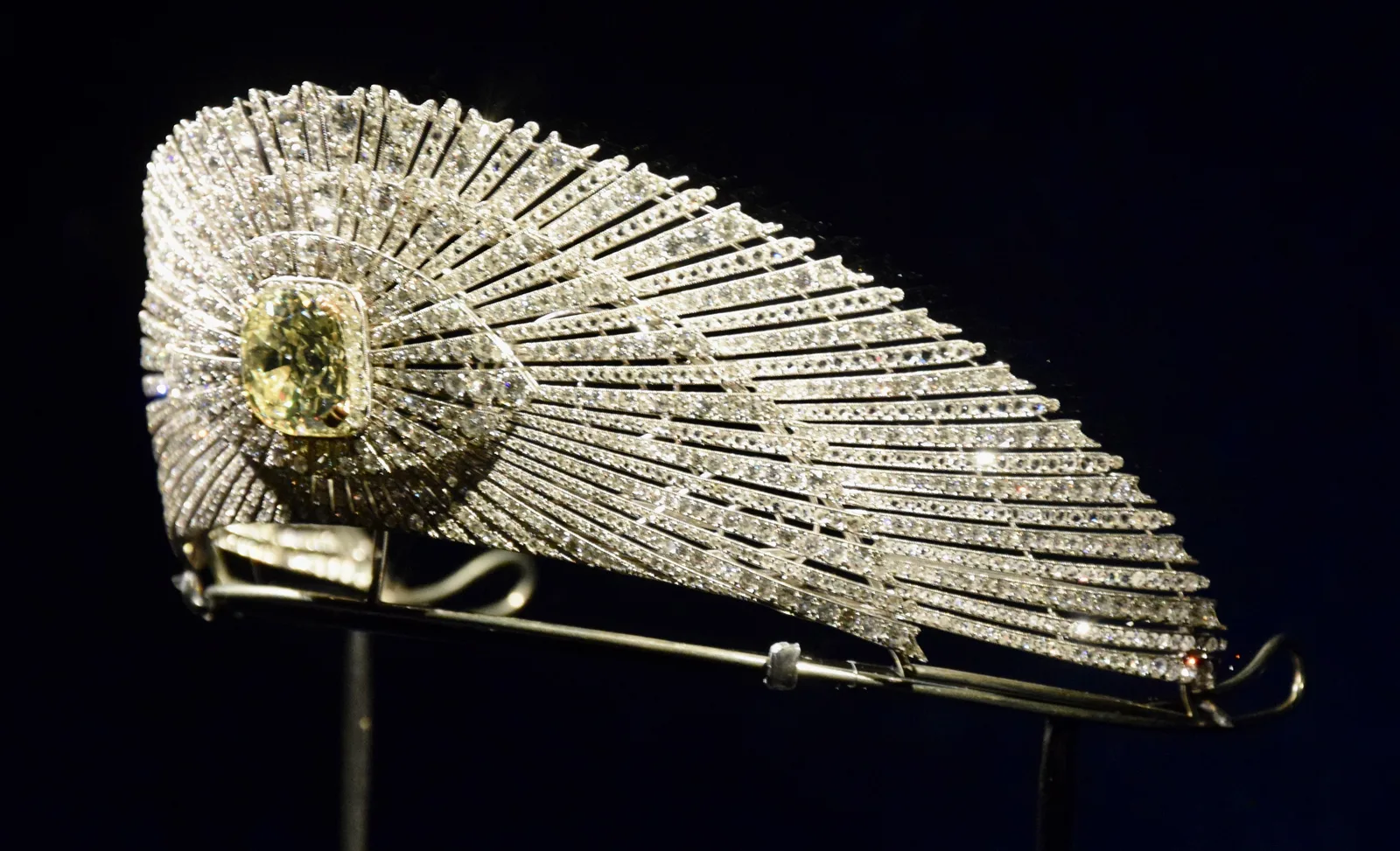 Cartier sun ornament with a central jonquil yellow diamond and a diamond wing