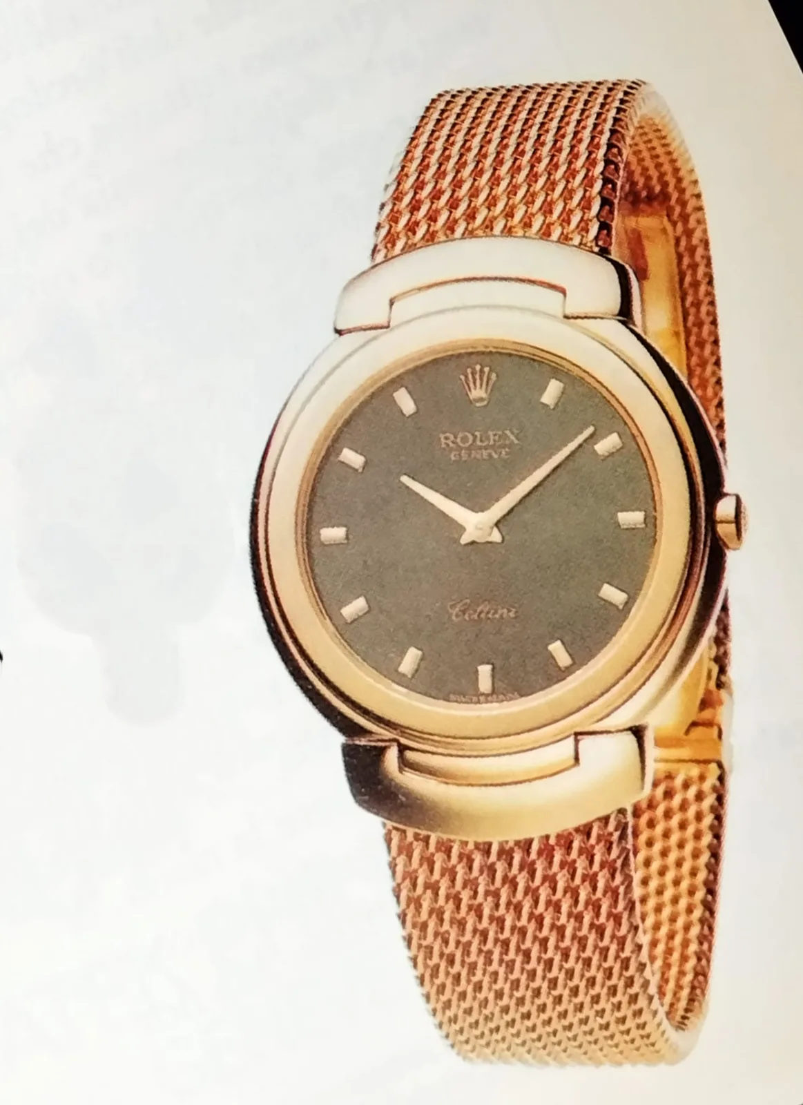 A late-1980s Rolex Cellini in yellow gold with a fluted bezel and a black dial, shown off the wrist