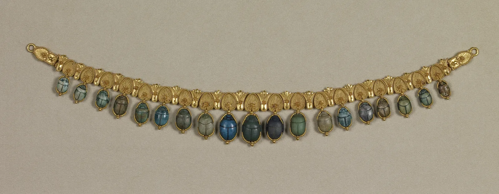 Giacinto Melillo gold collar with a fringe of carved scarabs in lapis lazuli and steatite