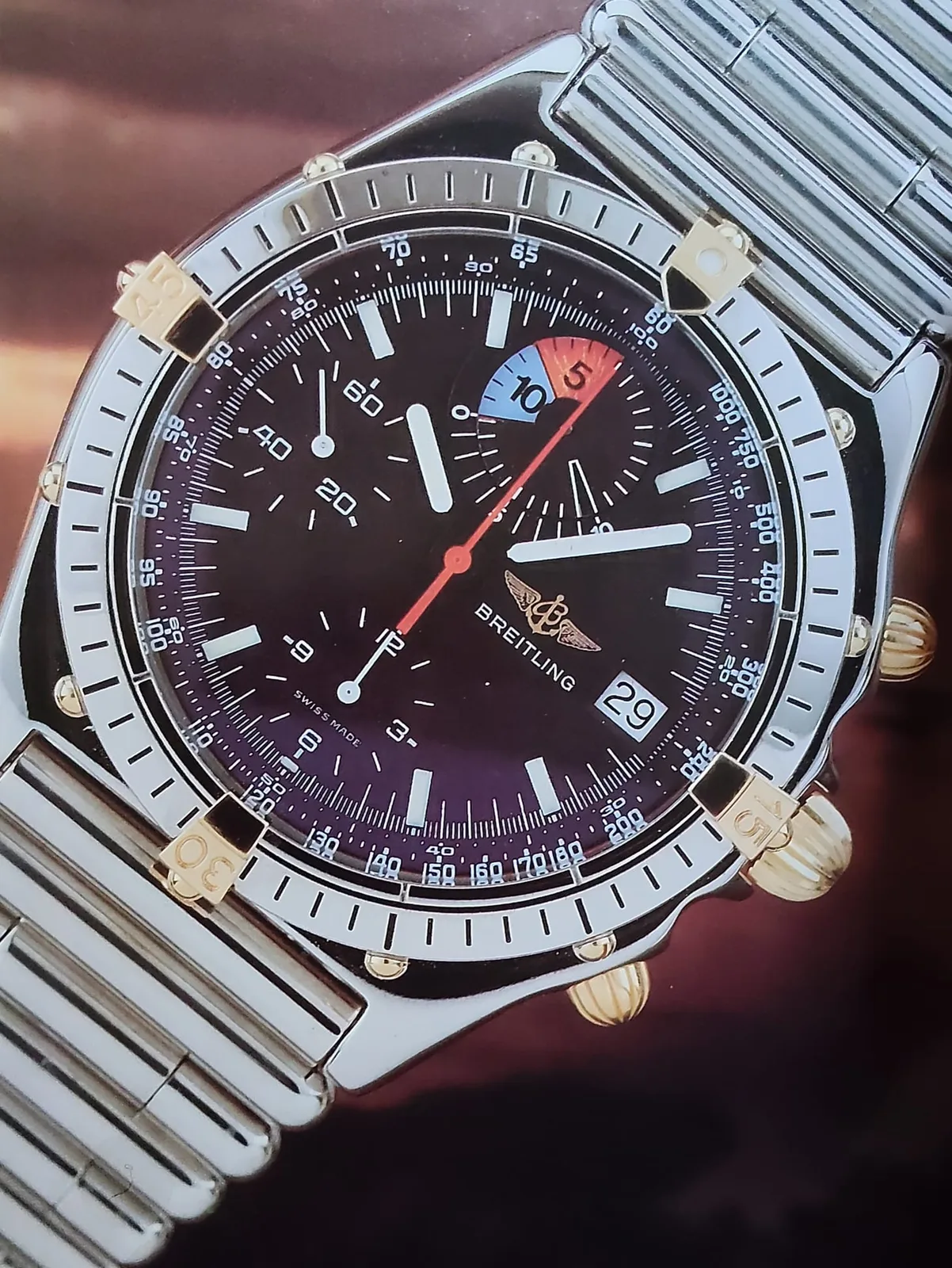 A Breitling Chronomat Yachting from the 1990s with a blue dial and four bezel tabs, shown off the wrist