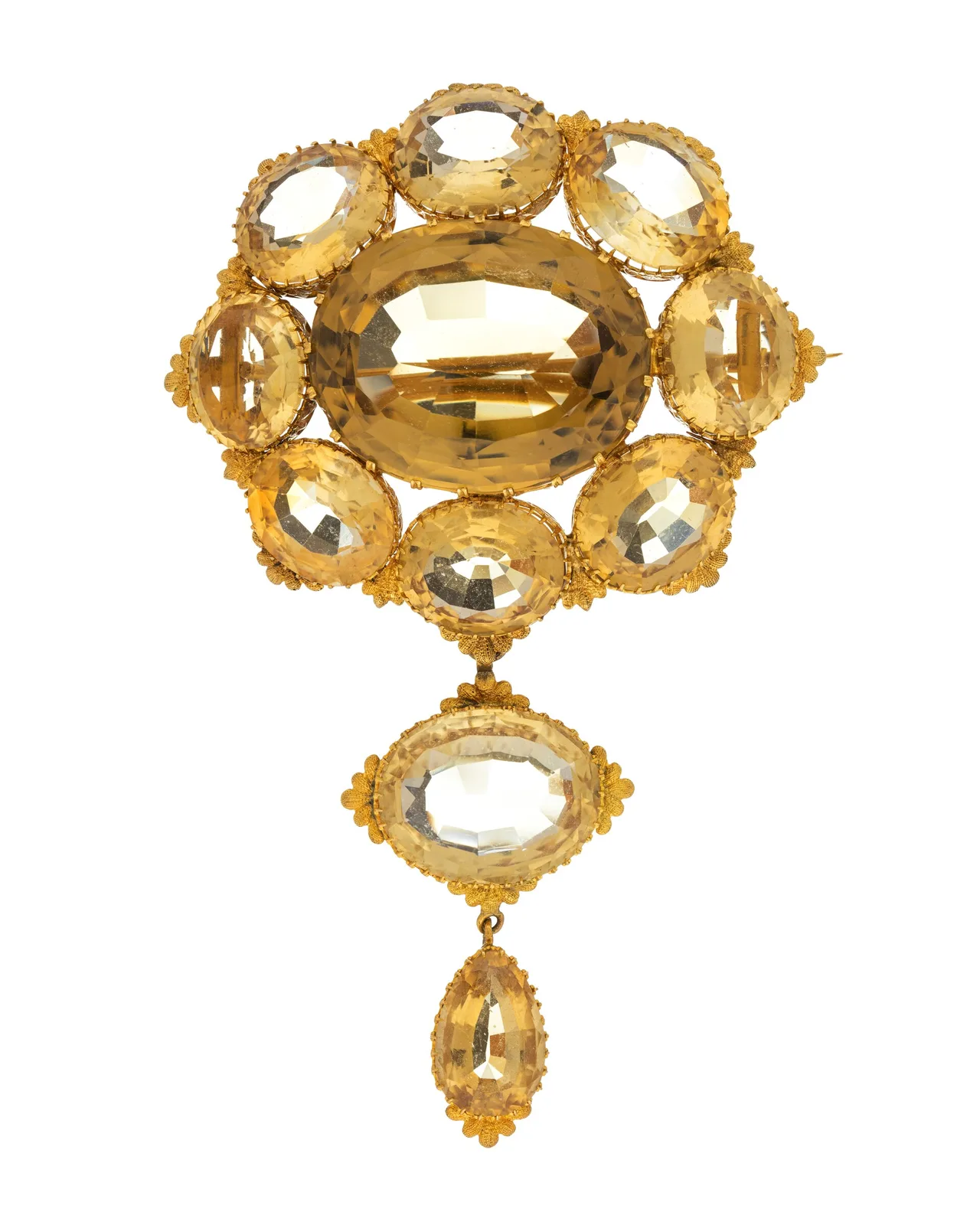 Nineteenth-century gold brooch with a large oval honey-yellow topaz in a ring of smaller ovals and two hanging yellow drops