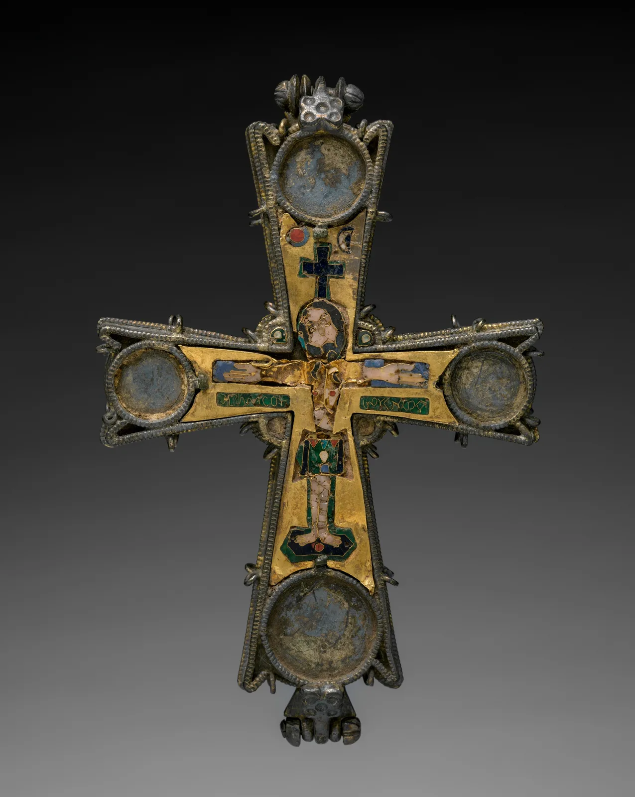 Byzantine gold pectoral cross with cloisonné enamel cells of Christ, Mary, and John, the gold wires visible between the colors