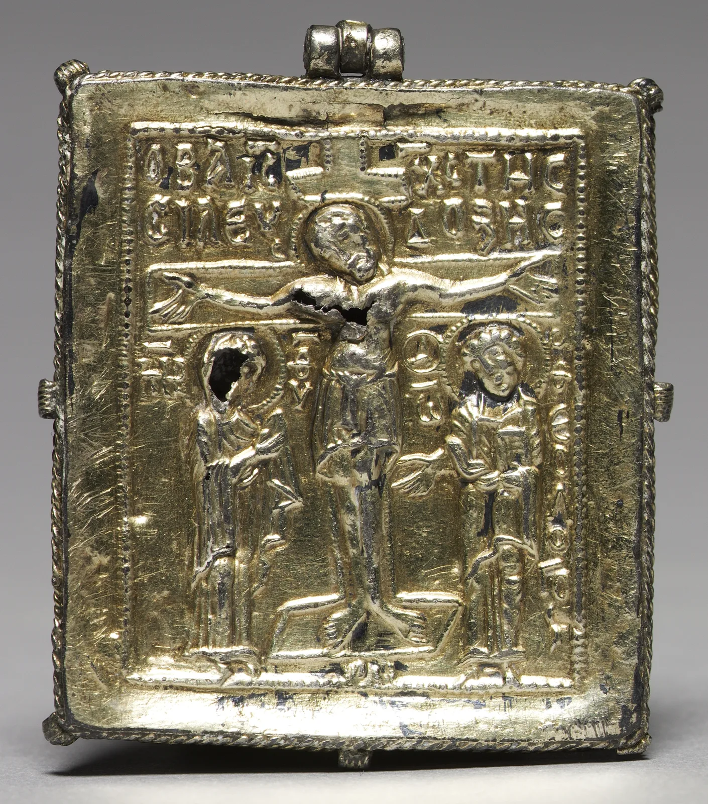 Byzantine enkolpion in cloisonné enamel, the Crucifixion built from gold-wire cells of blue, red, and white