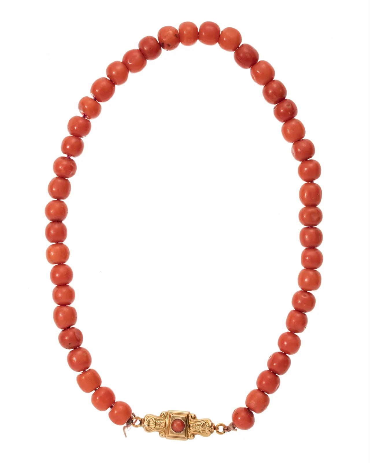 Mid-nineteenth-century necklace of round coral beads as one continuous warm-orange line, a small gold box clasp at the close