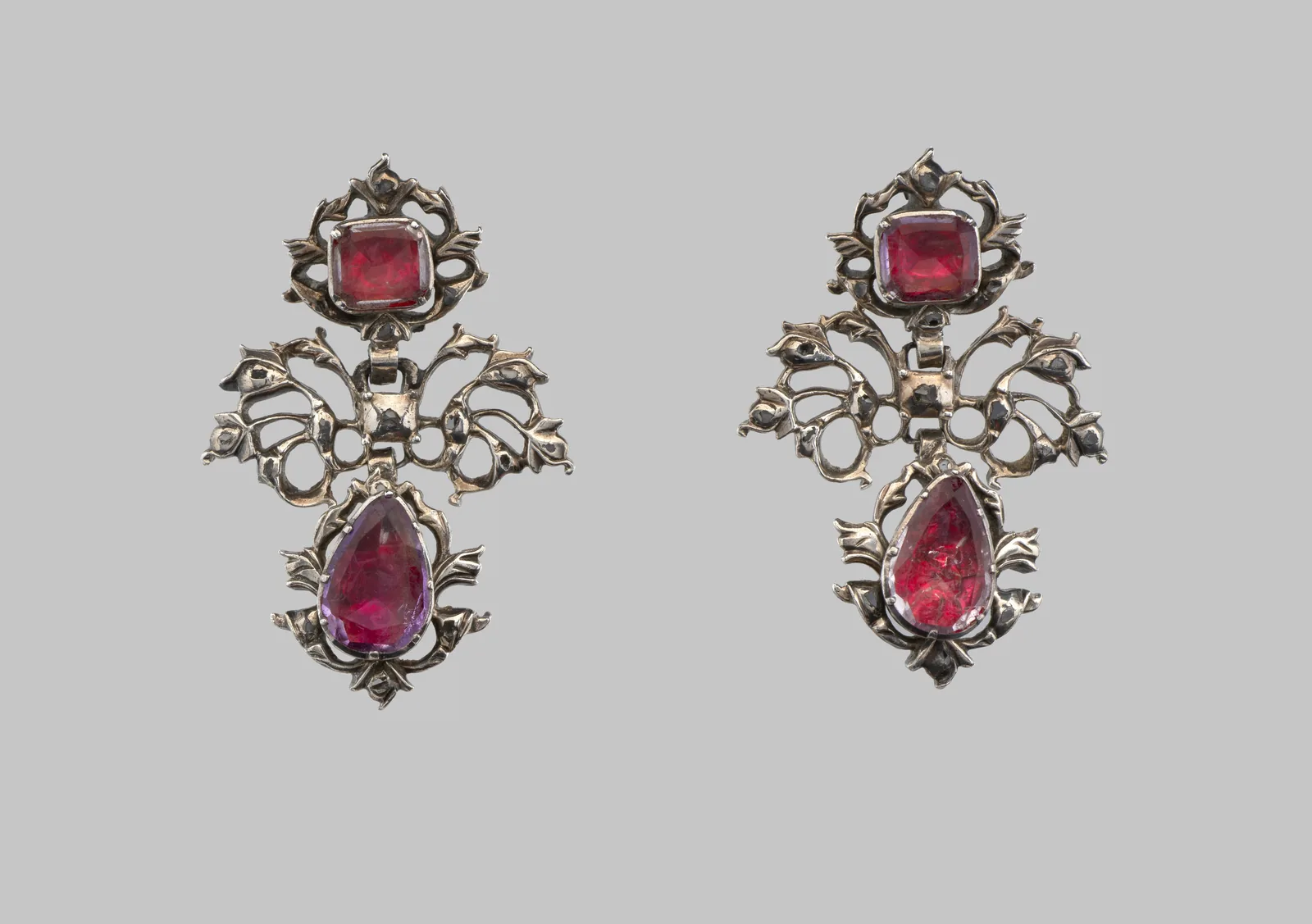 Pair of eighteenth-century silver earrings, each with a soft square pink jewel above a pear-shaped pink drop in openwork leaves