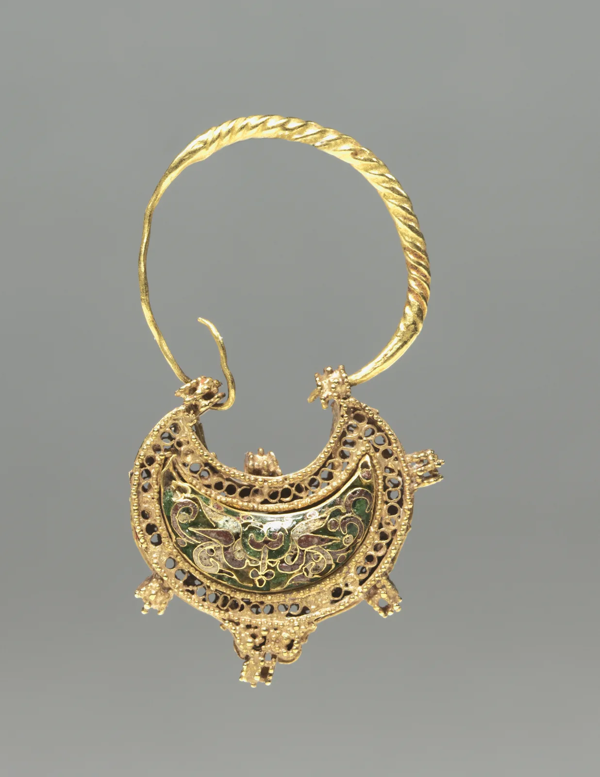 Byzantine gold crescent earring of twisted-wire hoop and open filigree scrolls around a green enamel panel