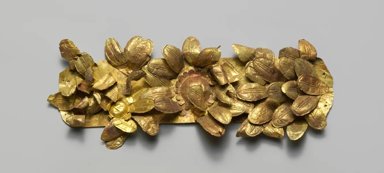 Etruscan gold funerary wreath formed as a horizontal field of thin gold petals and open flowers