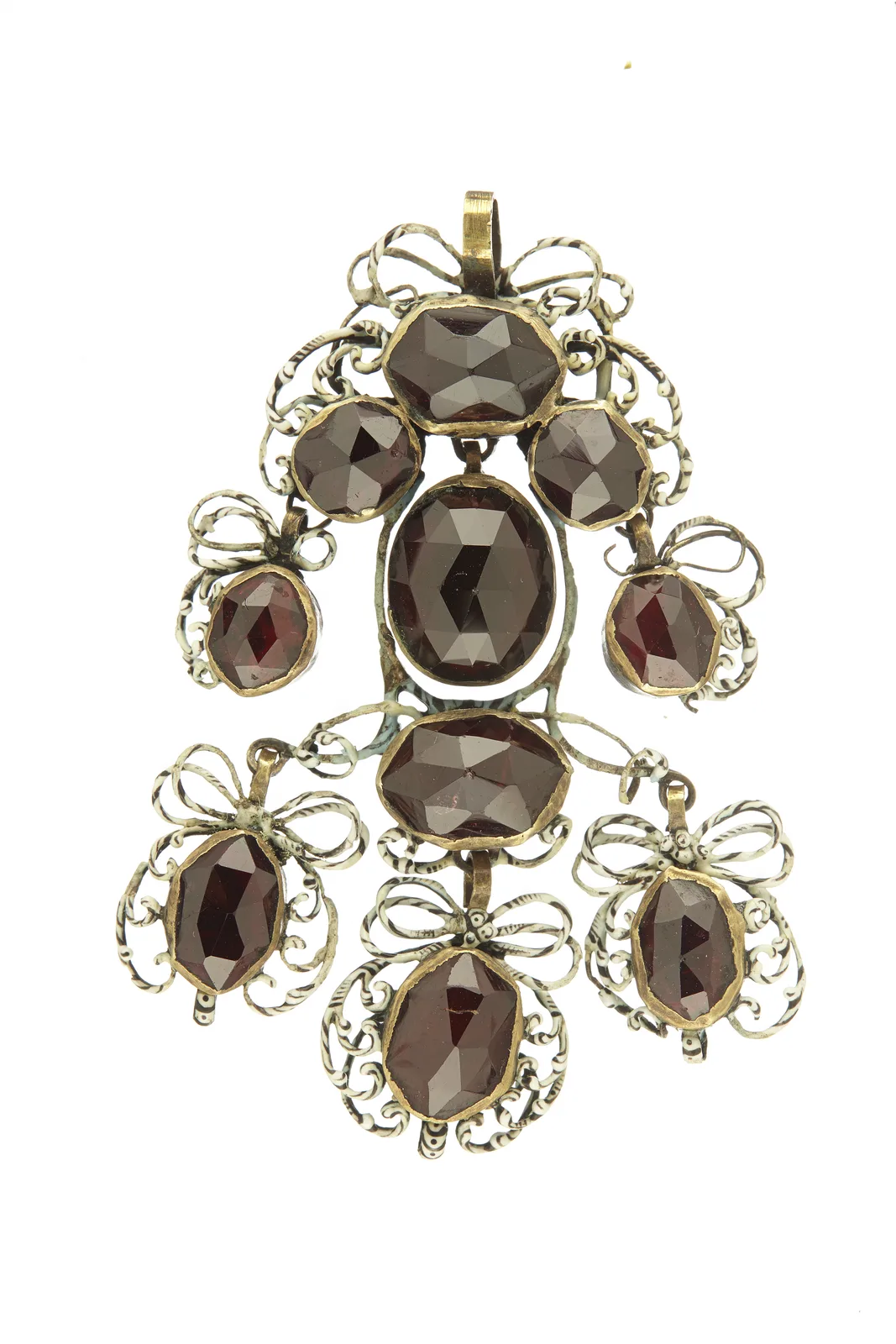 A pair of late seventeenth-century girandole earrings, each with a garnet bow and three pear-shaped garnet drops