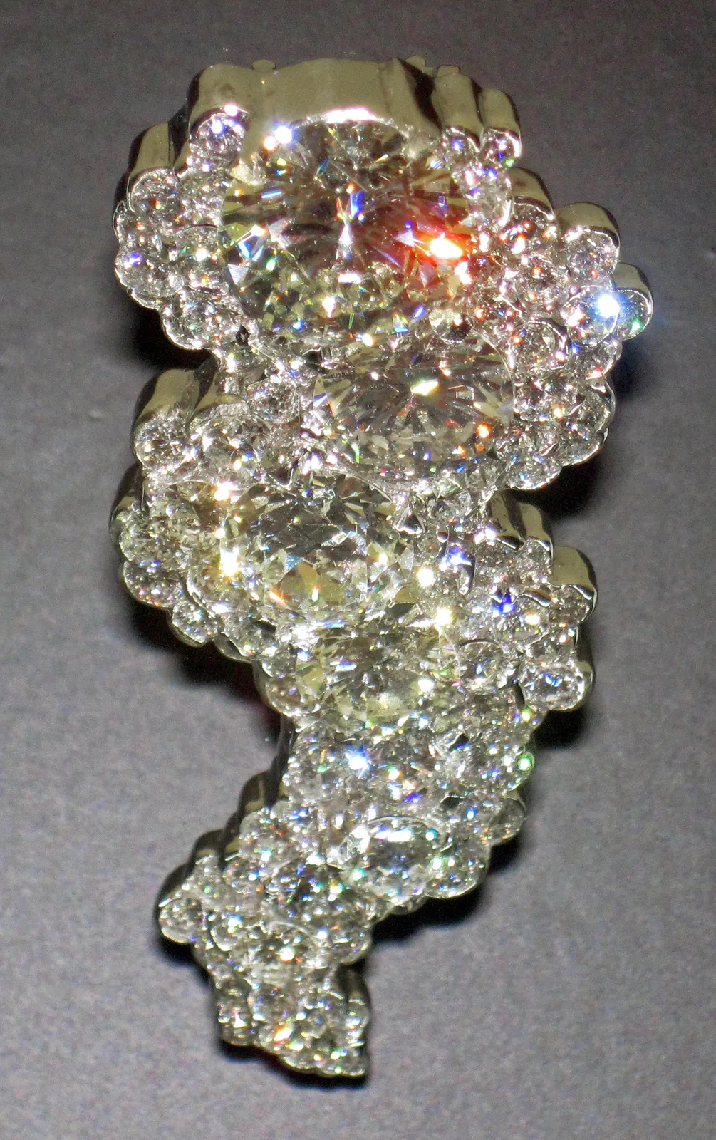 Two faceted diamonds seen from the side, each with a visible girdle between crown and pavilion