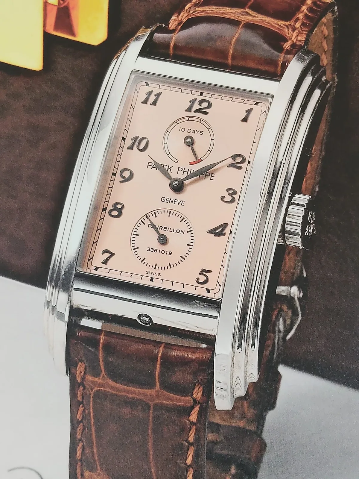 Platinum Patek Philippe Gondolo reference 5101P with a curved rectangular case, black dial, and tourbillon, shown off the wrist on a white ground