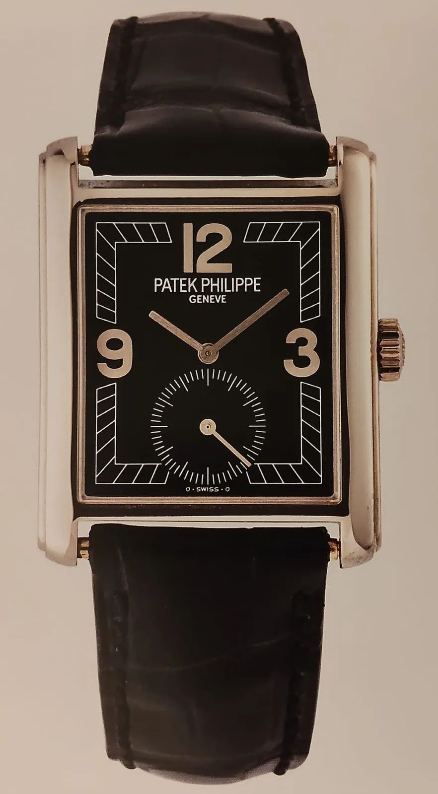 White-gold Patek Philippe Gondolo reference 5014 with a black dial, Breguet numerals, and a curved rectangular case, shown off the wrist on a white ground
