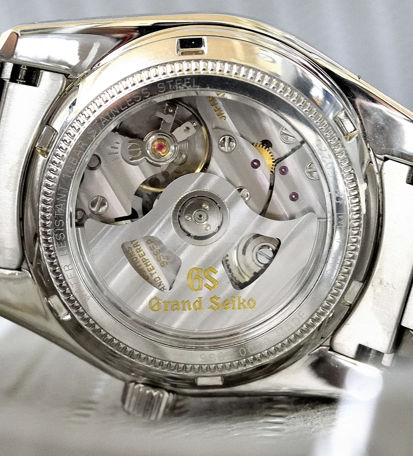 Grand Seiko caliber 9S65 automatic movement with striped bridges, shown off the wrist