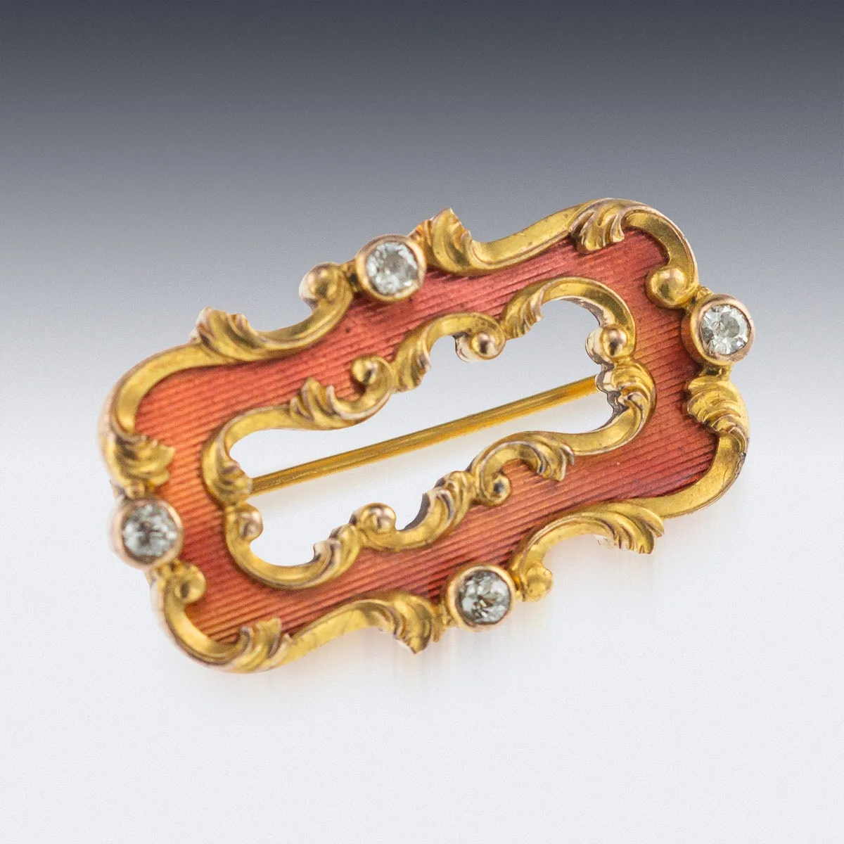 A nineteenth-century gold and guilloché enamel brooch by Oskar Pihl for Fabergé, with a rococo outline