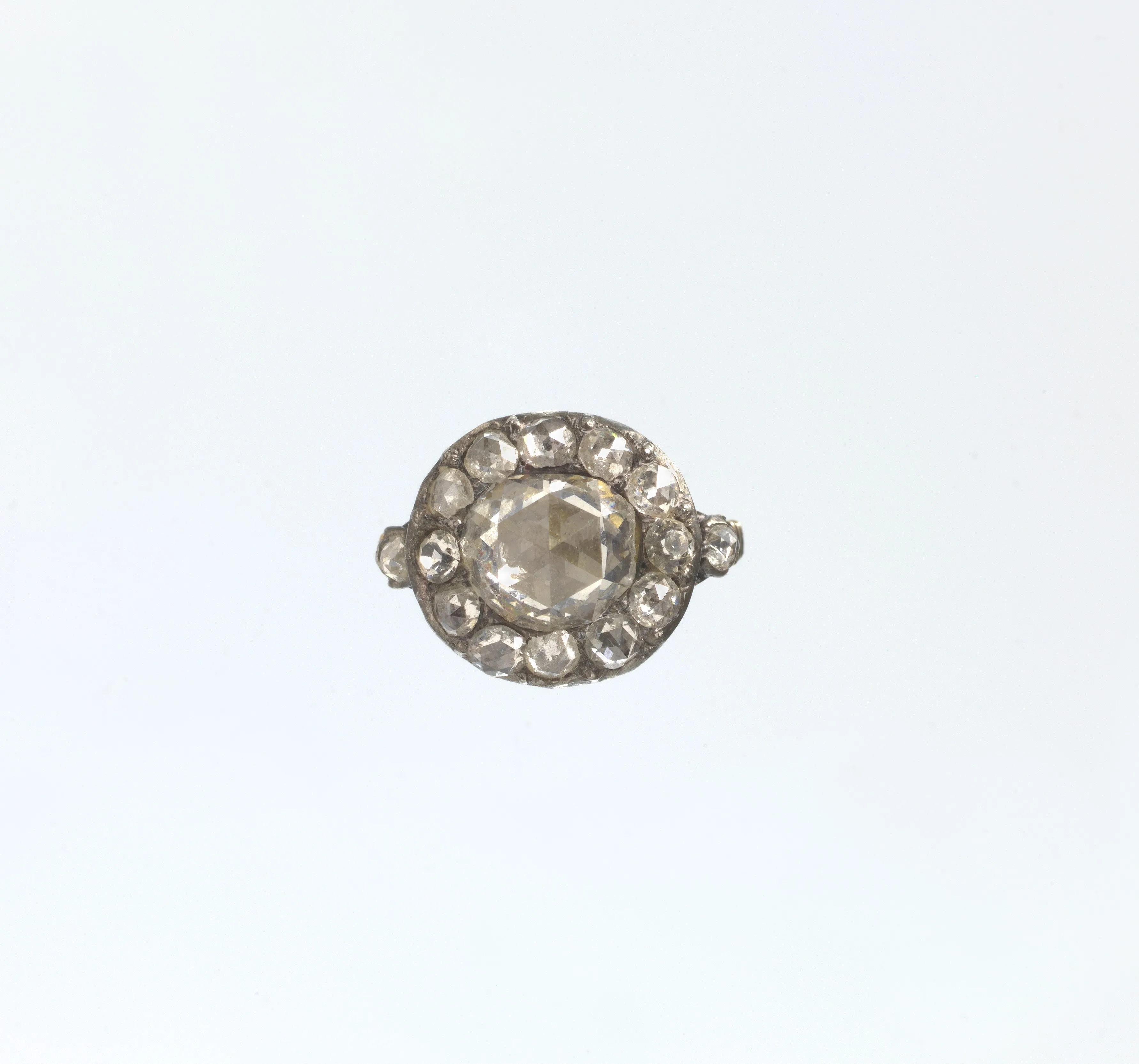 Eighteenth-century gold ring with a round diamond at the center circled by a tight ring of smaller diamonds
