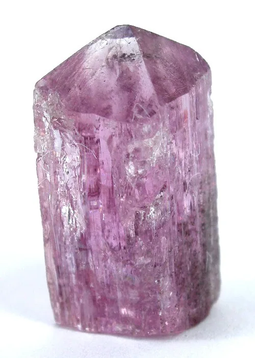 A short, blocky golden-orange imperial topaz crystal from Ouro Preto on a white ground