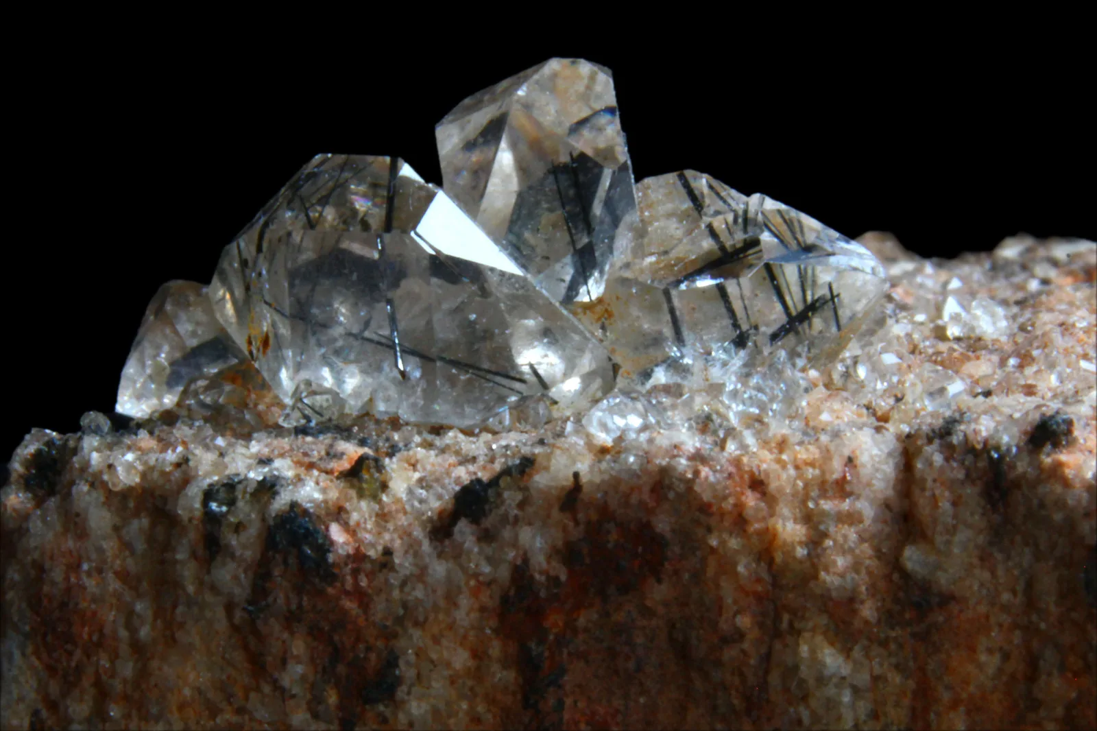 Clear quartz crossed by dark tourmaline crystals, from the Zagi Mine in Pakistan