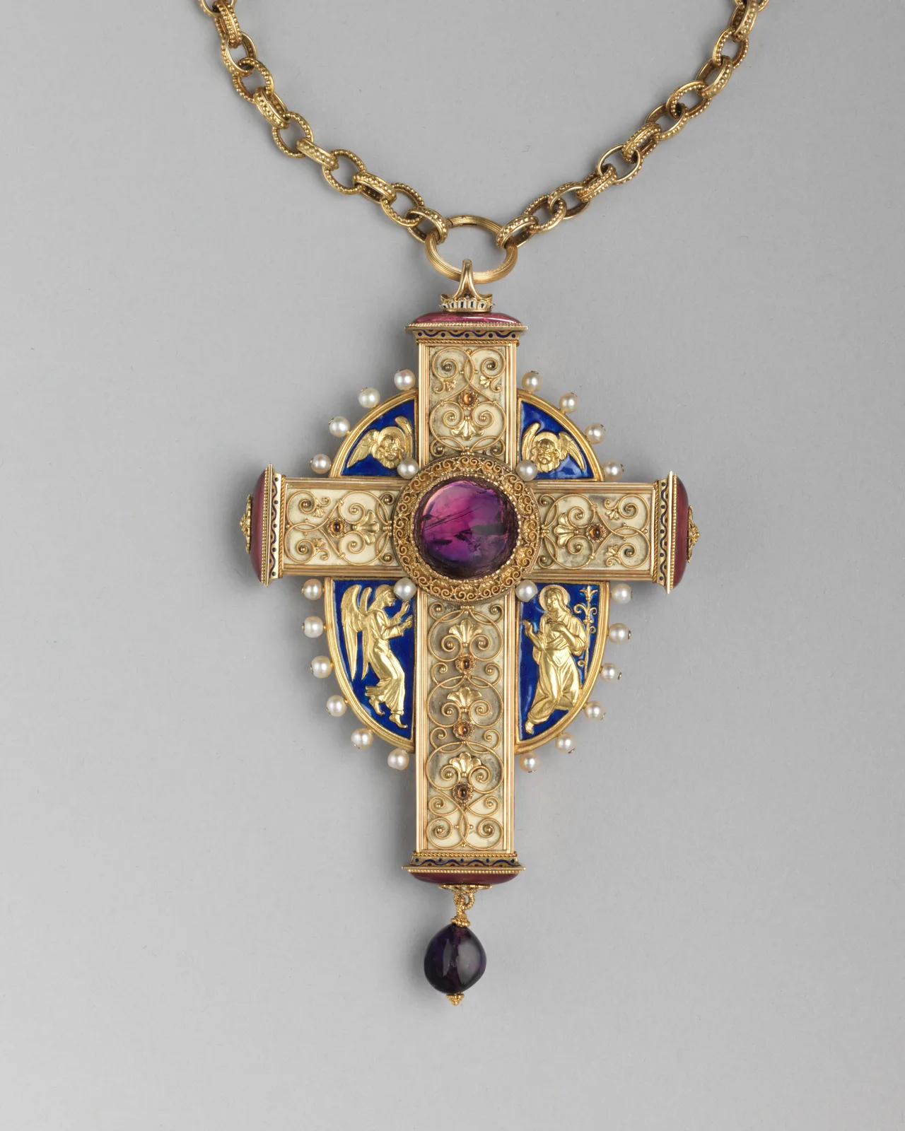 Hemmerle gold pectoral cross with filigree, blue and white enamel, a central amethyst cabochon, pearls, and a hanging amethyst drop