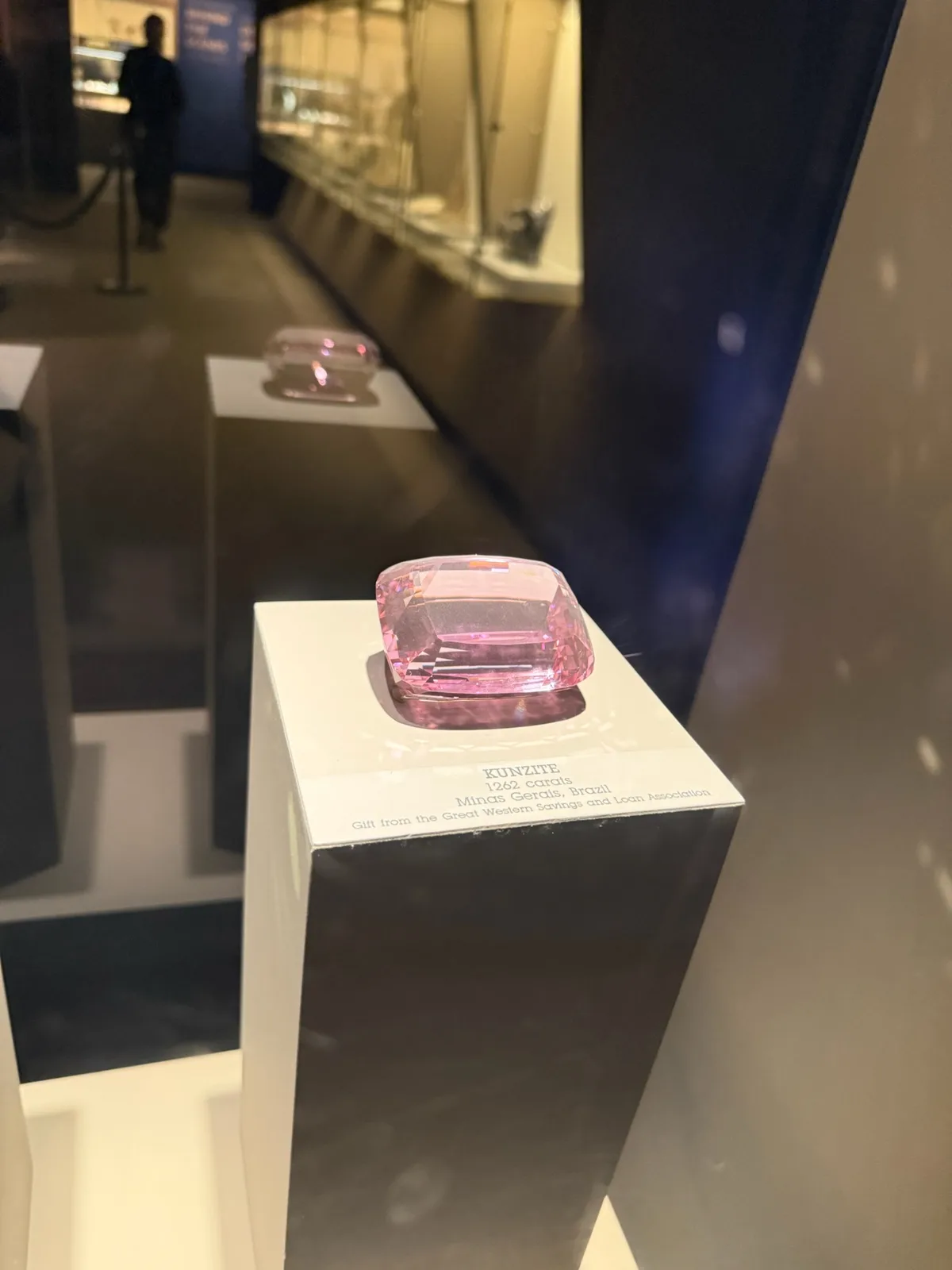 Faceted kunzite brilliant, a soft lilac-pink pane on a white ground