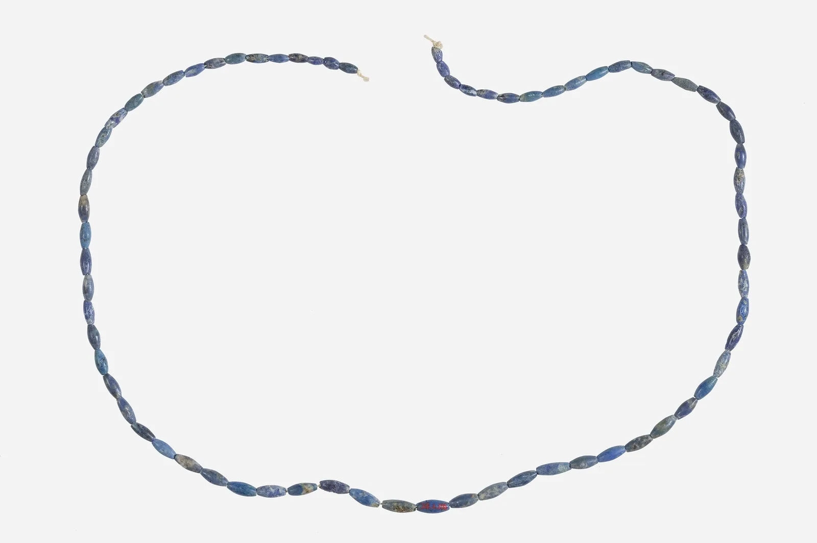 Middle Kingdom necklace of elongated lapis lazuli barrel beads strung in an open loop