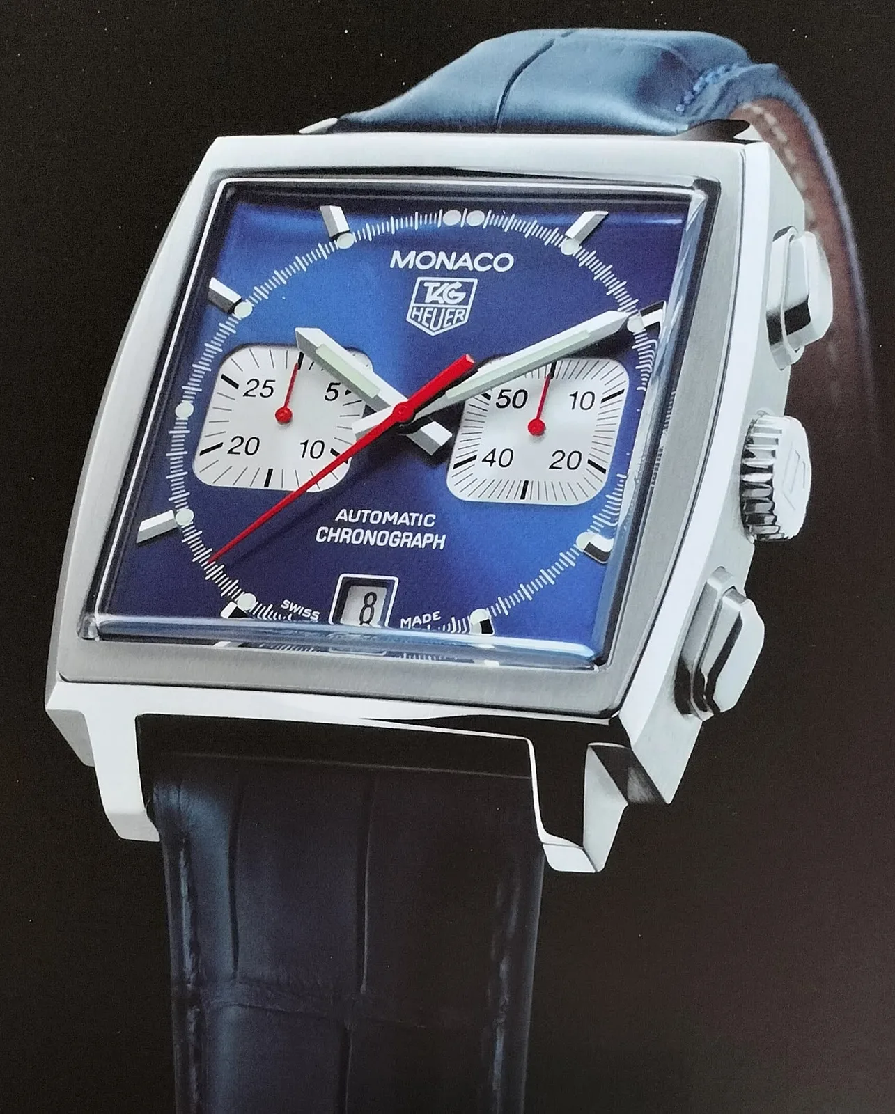 TAG Heuer Monaco, 2020, with a square case and a metallic blue dial, shown off the wrist on a white ground