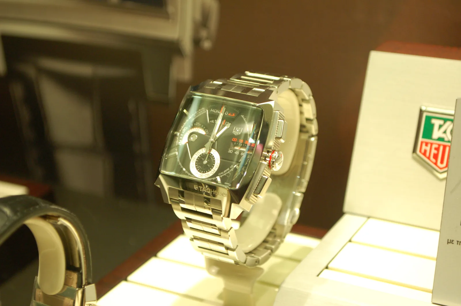 TAG Heuer Monaco LS Calibre 12 with a blue dial, square registers, and the crown on the left, shown off the wrist