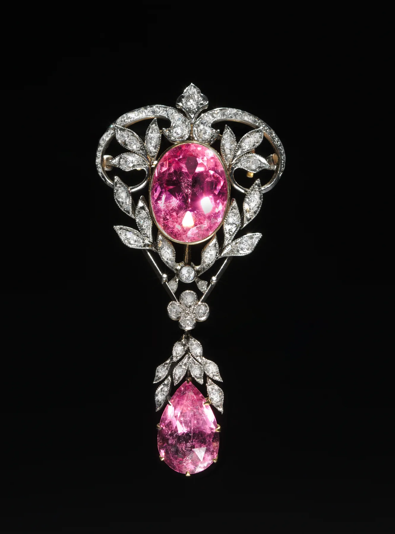 Belle Époque pendant brooch with a large oval pink tourmaline and a pear pink drop, diamond openwork leaves around them