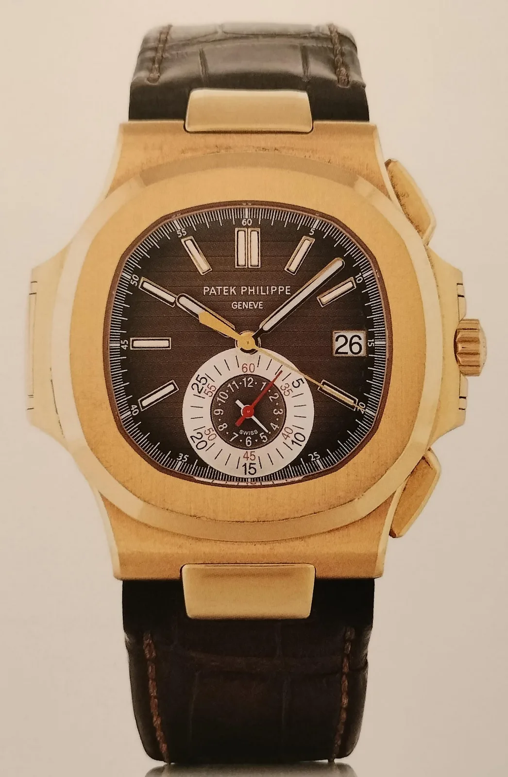 Steel Patek Philippe Nautilus reference 5980 flyback chronograph with a rounded octagonal bezel and integrated bracelet, shown off the wrist
