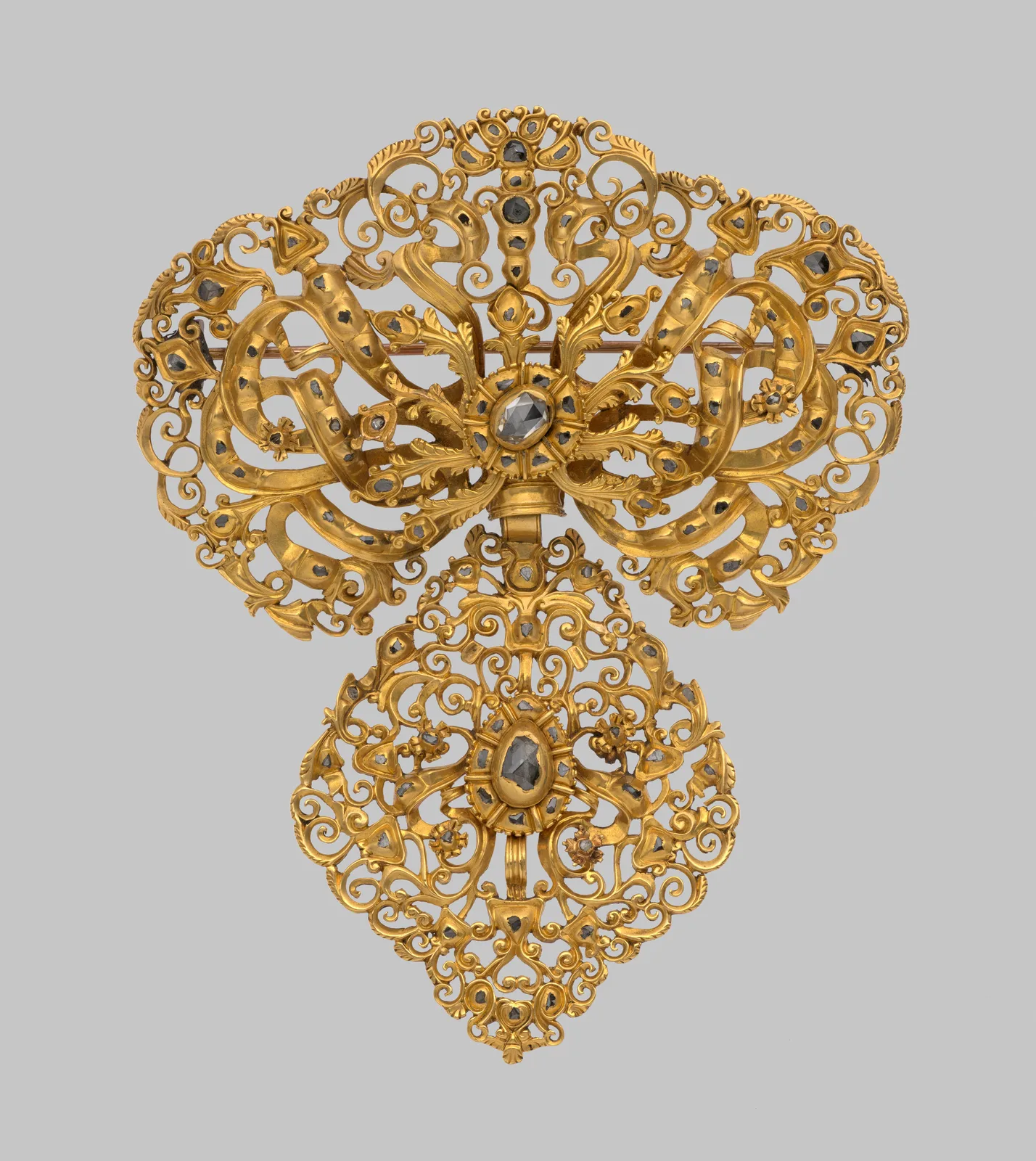 Eighteenth-century gold corsage ornament of scrolling openwork set throughout with small diamonds