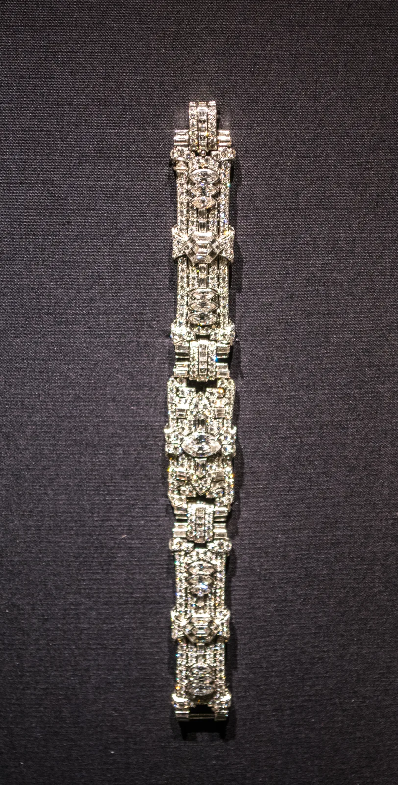 Art Deco platinum bracelet with geometric links densely set in diamond pavé and baguette borders