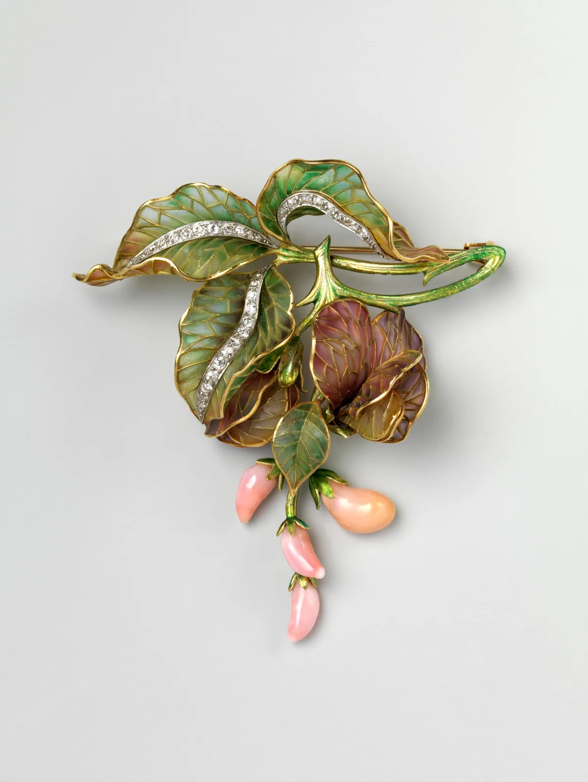 A Marcus and Co. brooch of about 1900 with a conch pearl, diamonds, and plique-à-jour enamel in a leafy spray