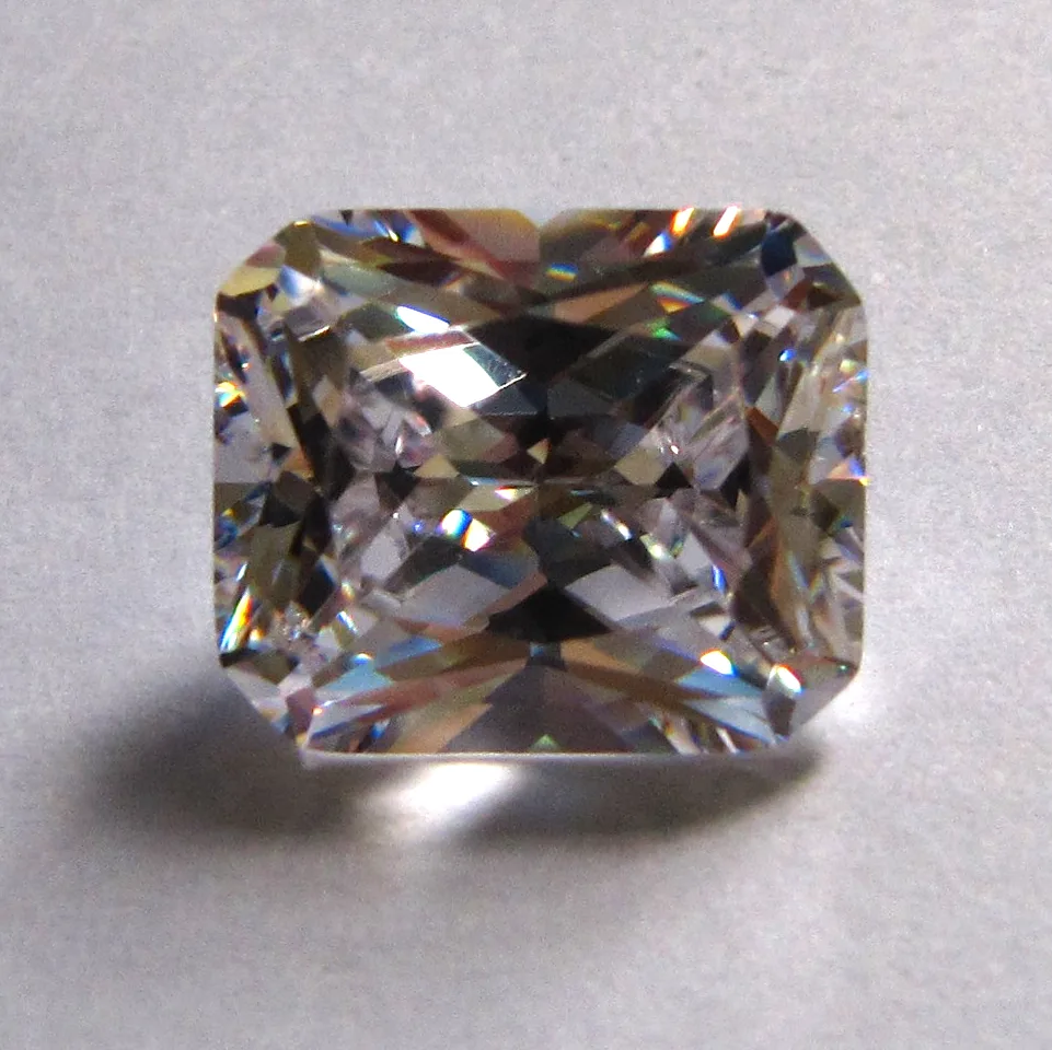 Radiant-cut diamond seen from above, a square outline with cropped corners and a brilliant facet pattern