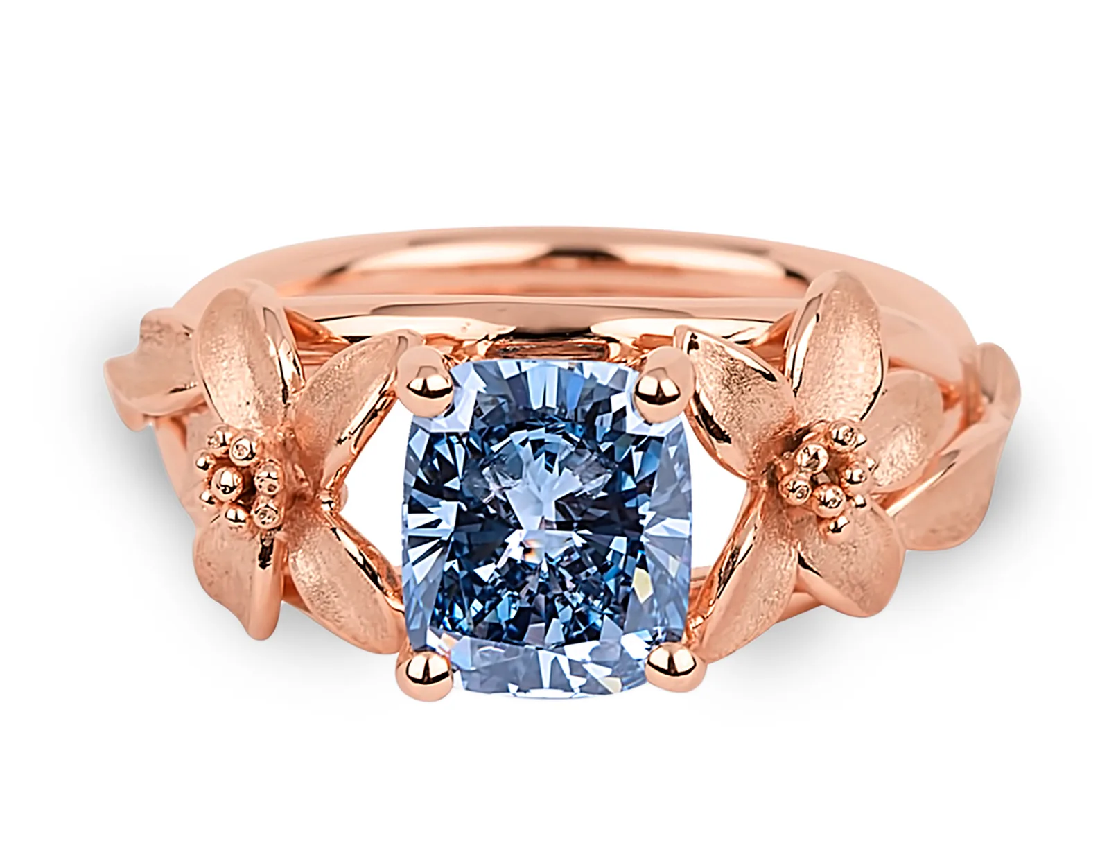 The Jane Seymour, a fancy vivid blue radiant-cut diamond in a ring with a floral motif on either side, on a white ground