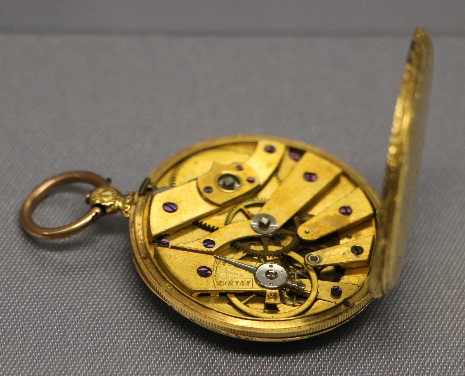 Gilt Le Roy watch turned to the case back, the movement exposed on the reverse