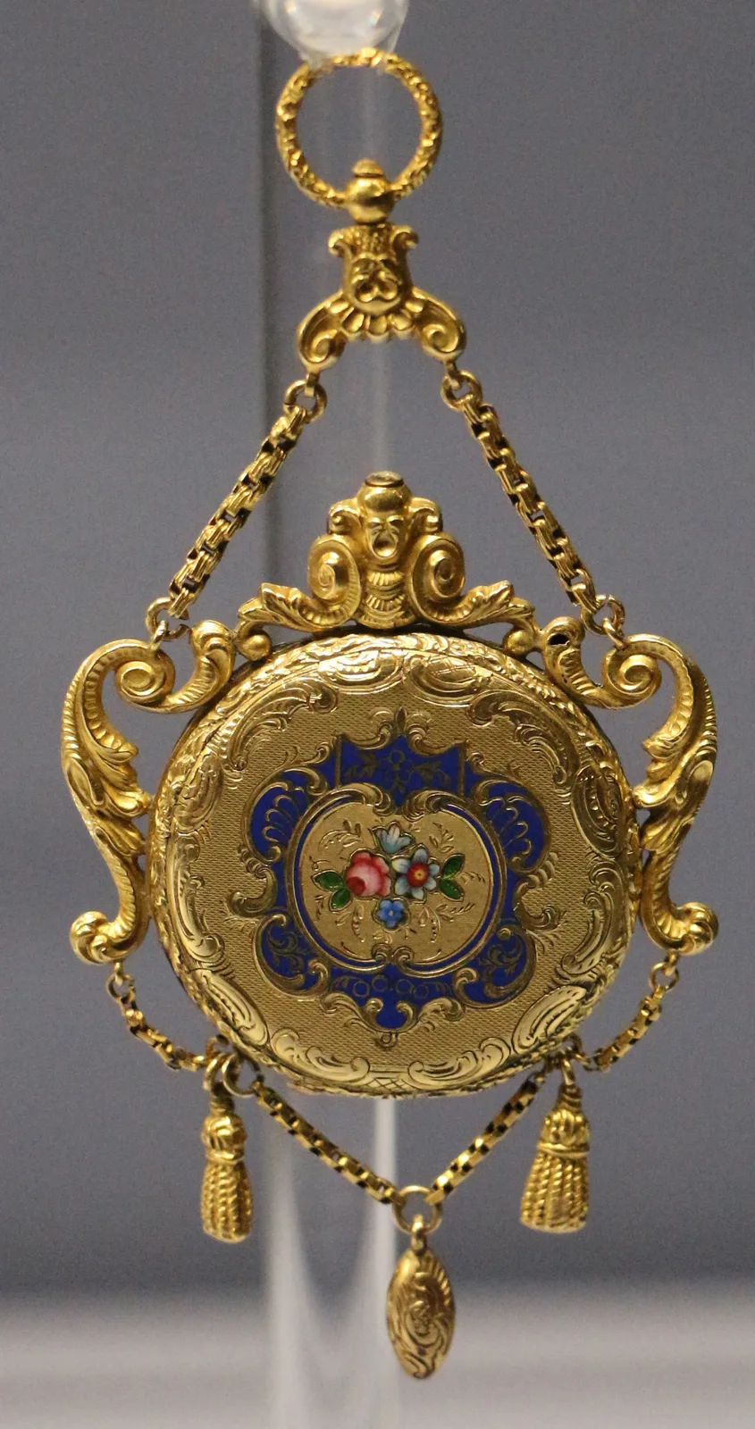 Gilt musical watch by Henry Capt, shown as a decorated case back