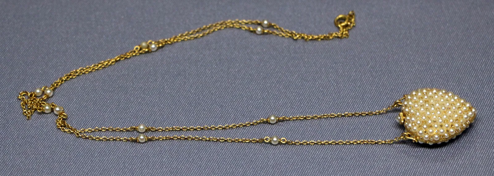 Necklace watch of about 1890 shown from the reverse of the pendant