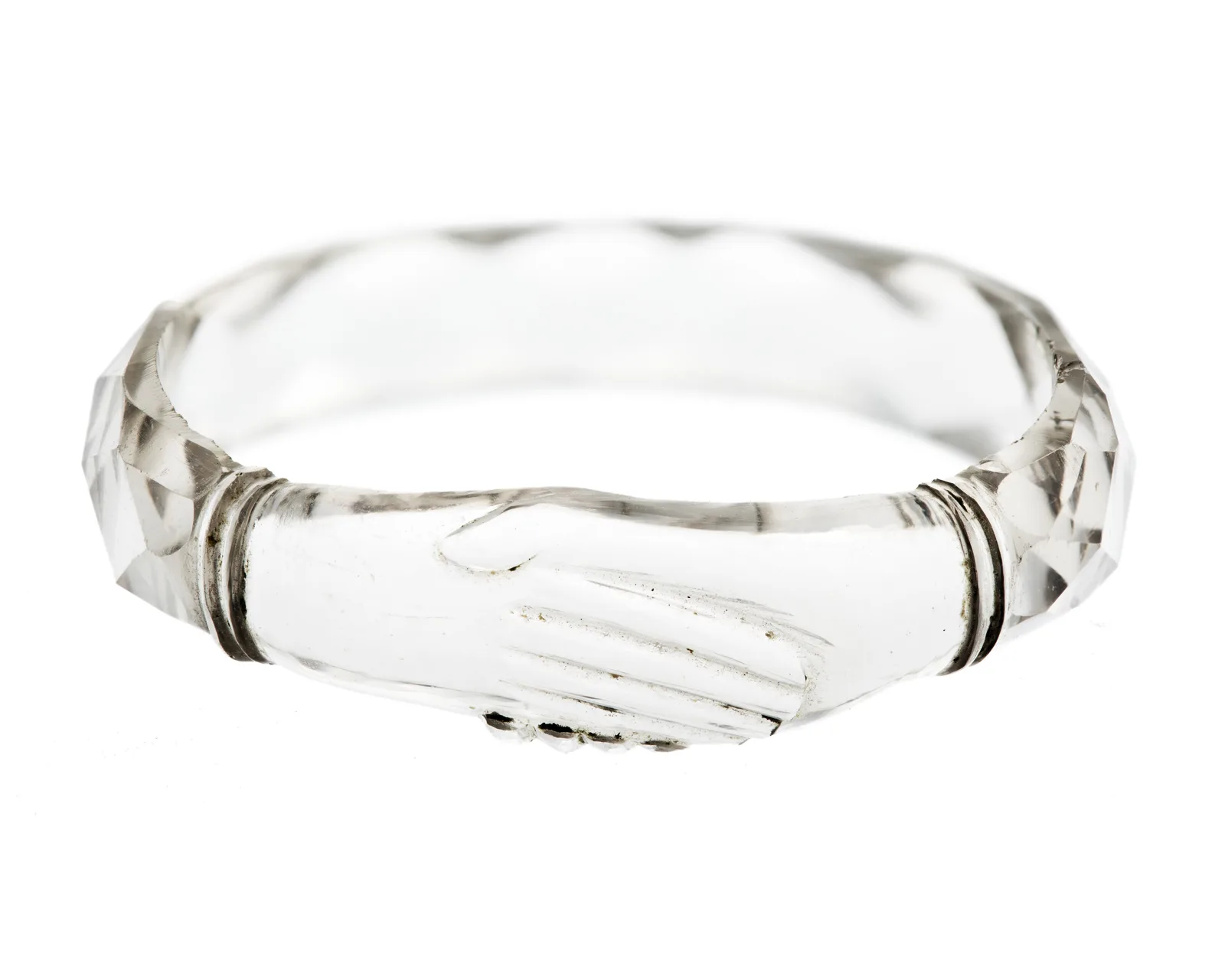 A nineteenth-century ring carved from rock crystal, the hoop and a small bow at the face cut from the same clear stone