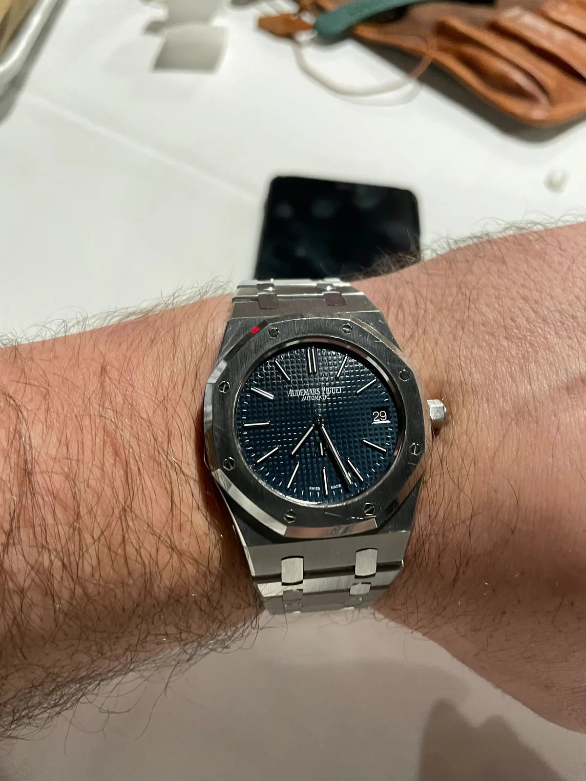 Steel Audemars Piguet Royal Oak reference 15202 with a blue dial, octagonal bezel, and exposed screws, shown off the wrist