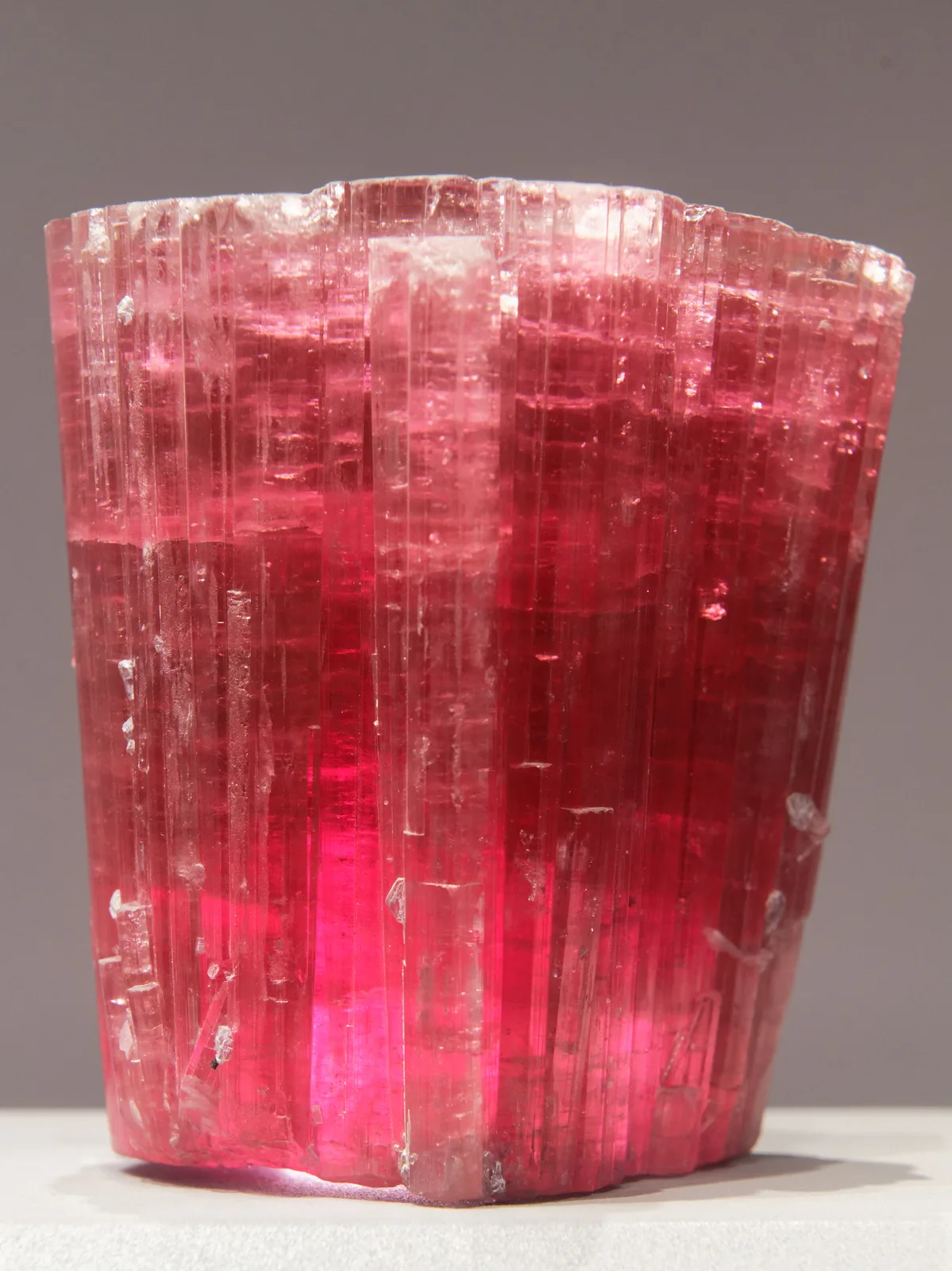 Vivid pink rubellite crystals in a pale matrix, a museum specimen from Pala, California
