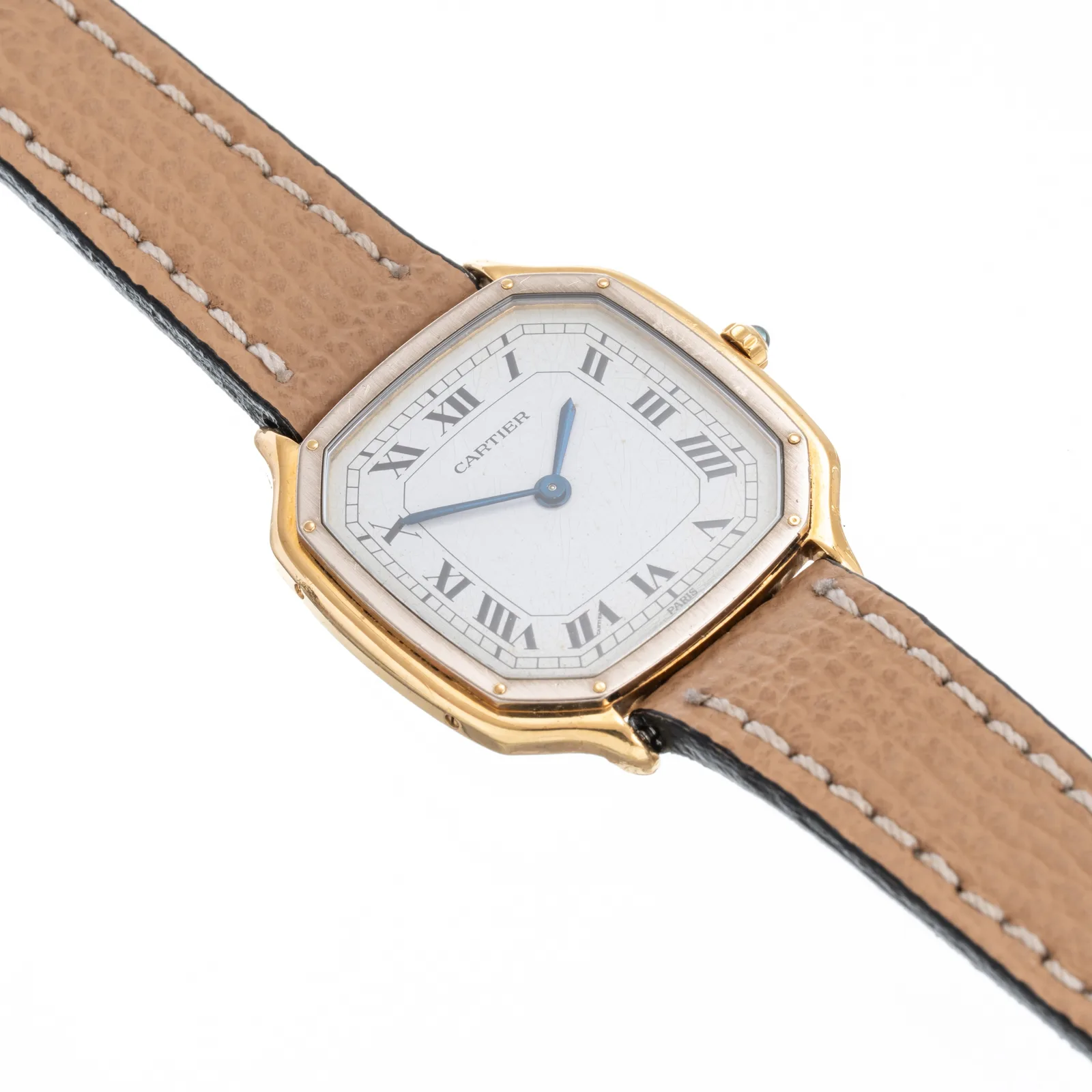 Cartier octagonal watch with a cream Roman dial, gold case, and tan leather strap