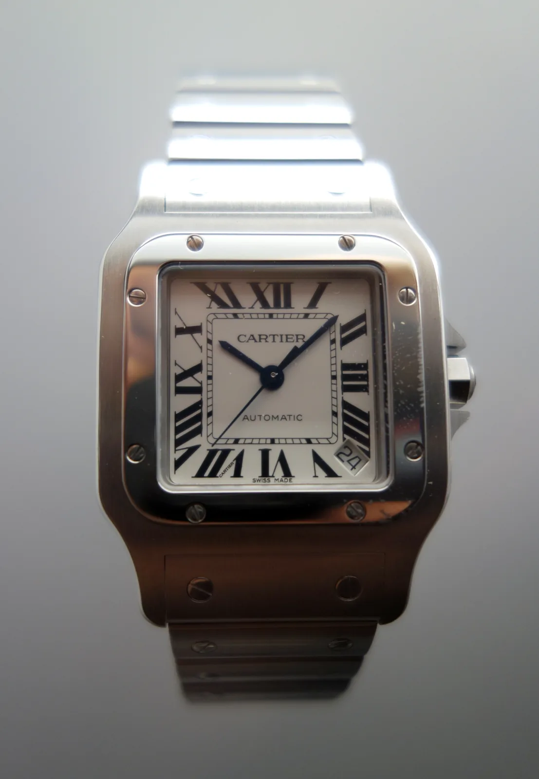 Santos de Cartier Galbée with a square case and visible screws, Design Museum, London