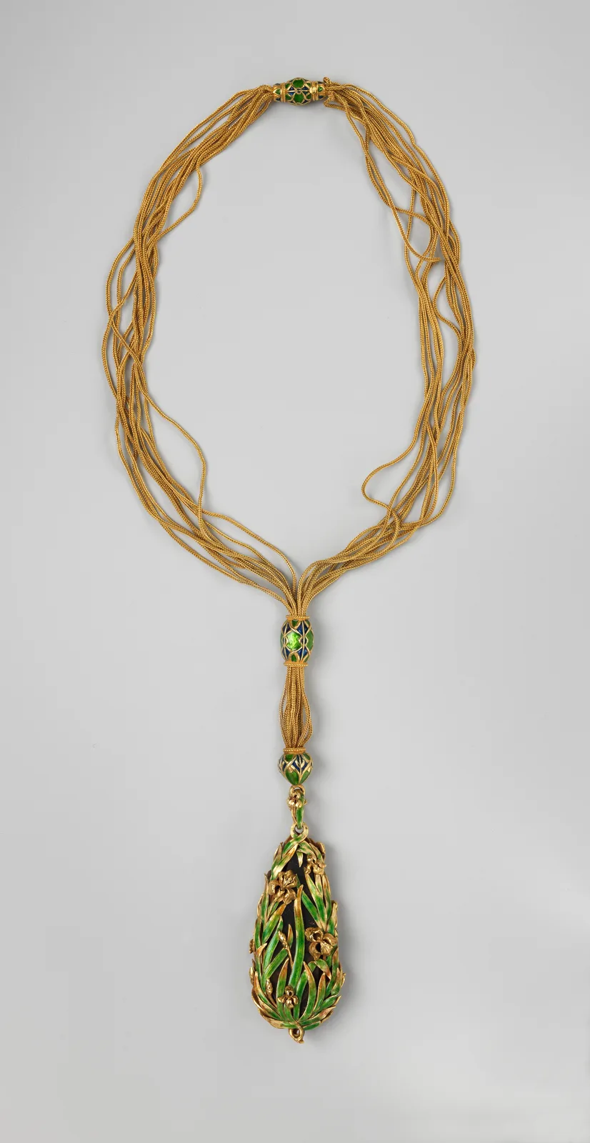 Marcus & Co. gold sautoir with a black-opal pendant surrounded by enameled iris leaves